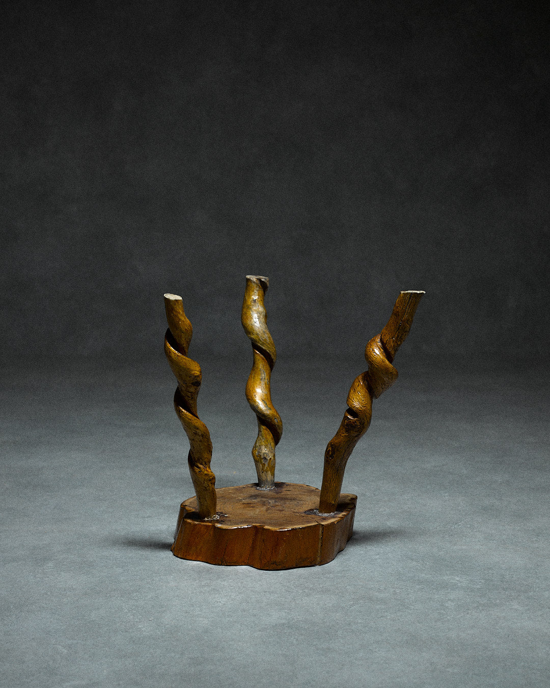 Small Tripod Stool — back view of twisted wooden legs