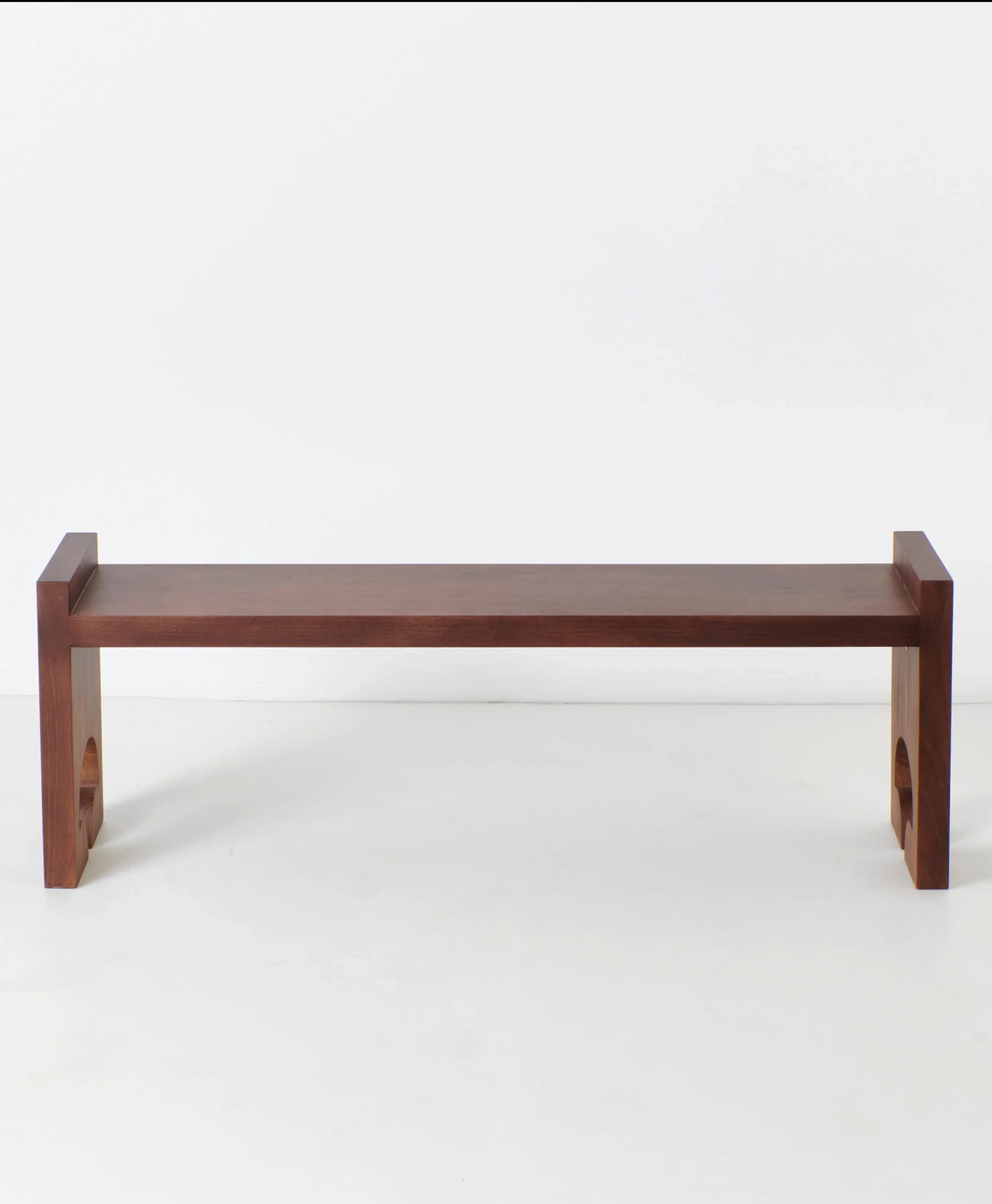 Quinta Bench — side angle showing rich wood finish and clean lines