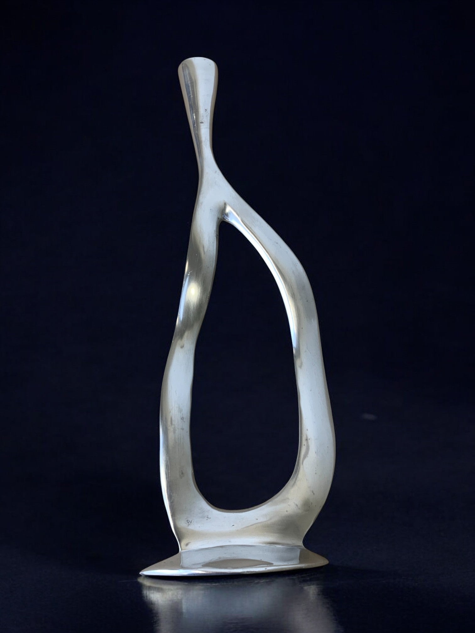Biomorphic candleholder, solid aluminum, 1970's — detail view