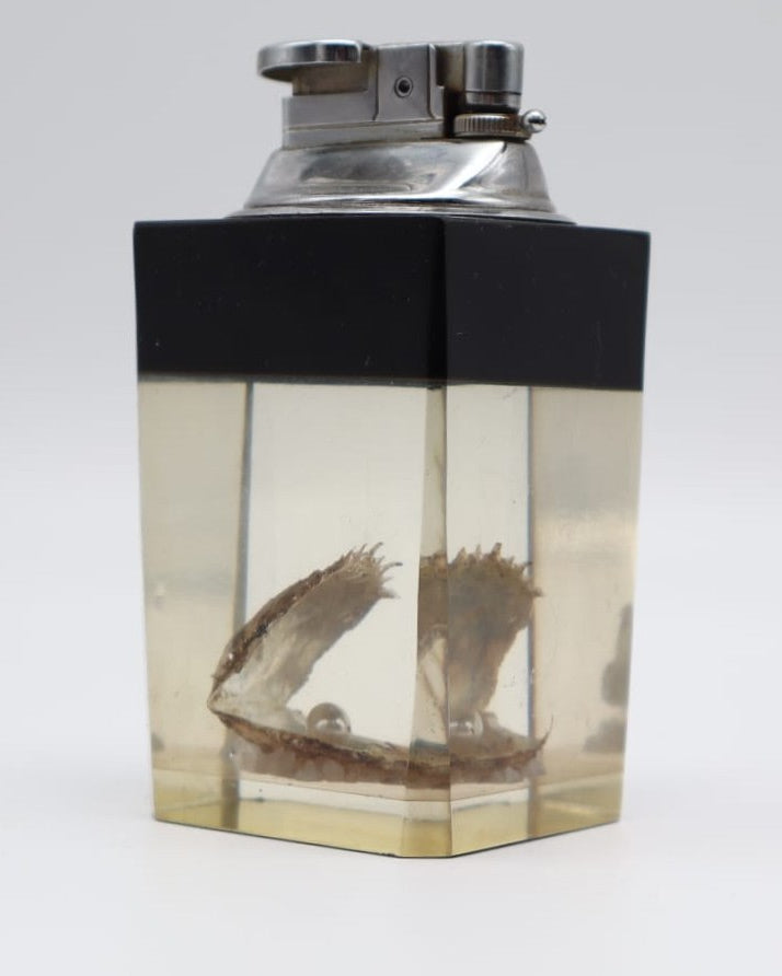 1970s Sculptural Lucite Table Lighter with Inset Oyster & Pearl — lifestyle setting