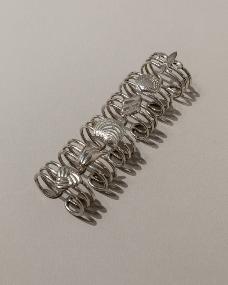 Set of 6 vintage silver-plated shell napkin rings detail view