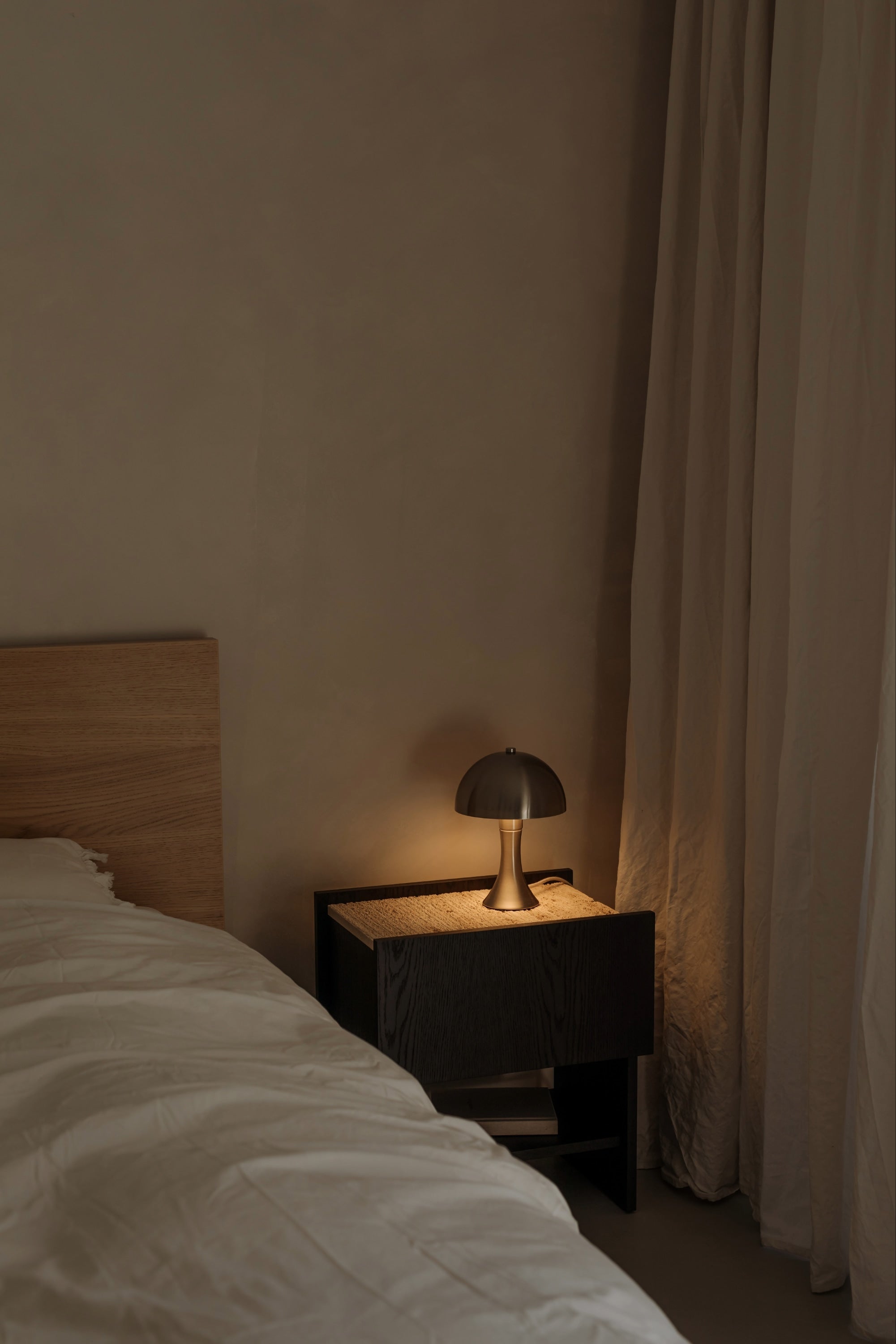 NOTO Night Stand — back view with dark wood finish and lamp