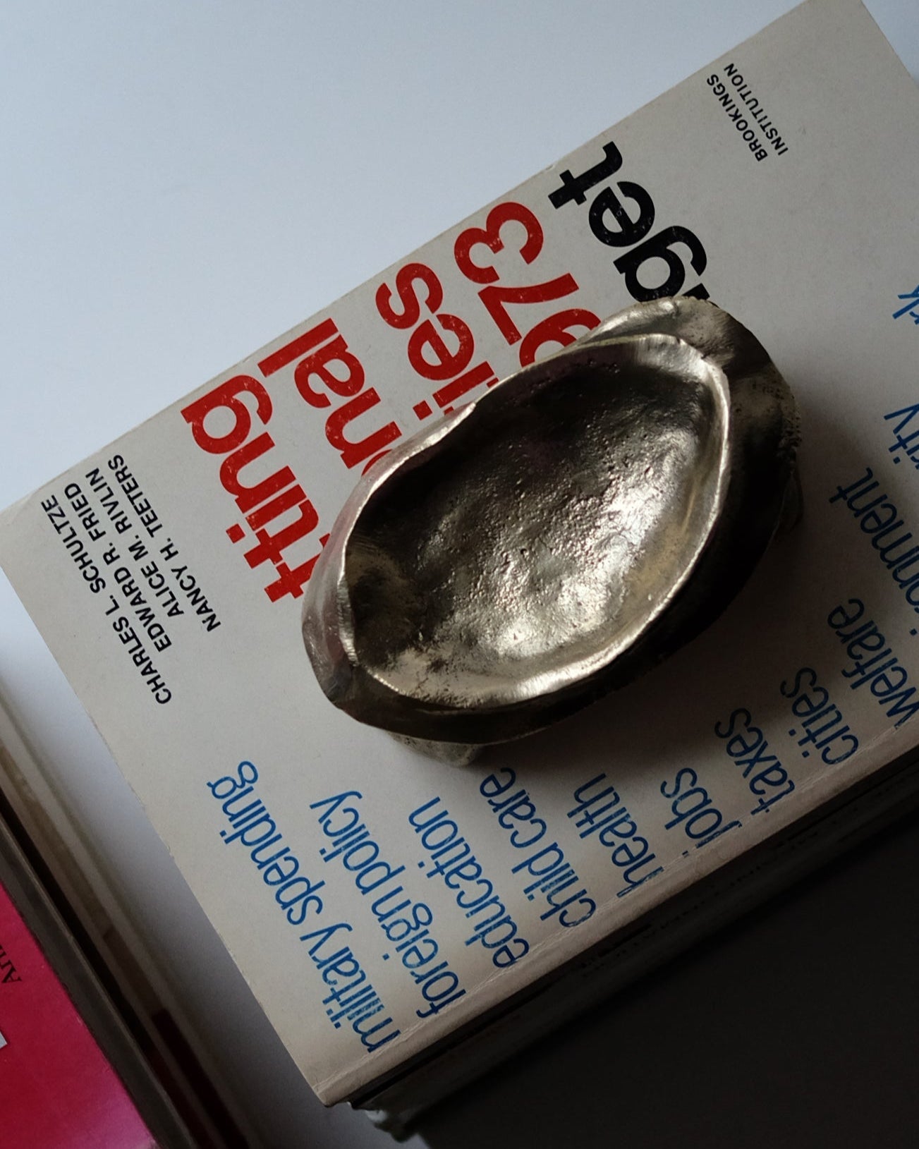 MOORE Tray/Catchall — top view of brass tray on books