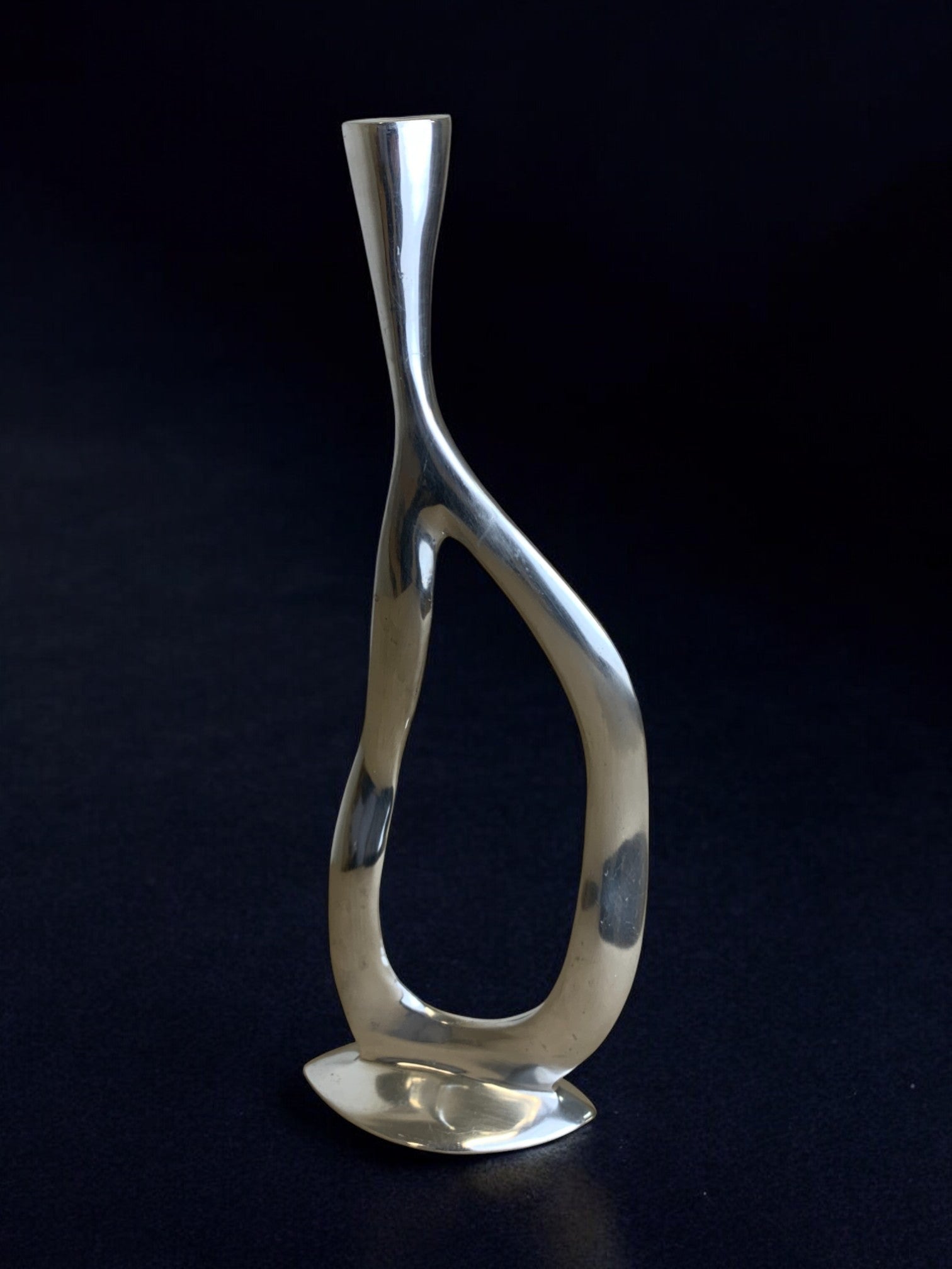 Biomorphic candleholder, solid aluminum, 1970's — lifestyle setting