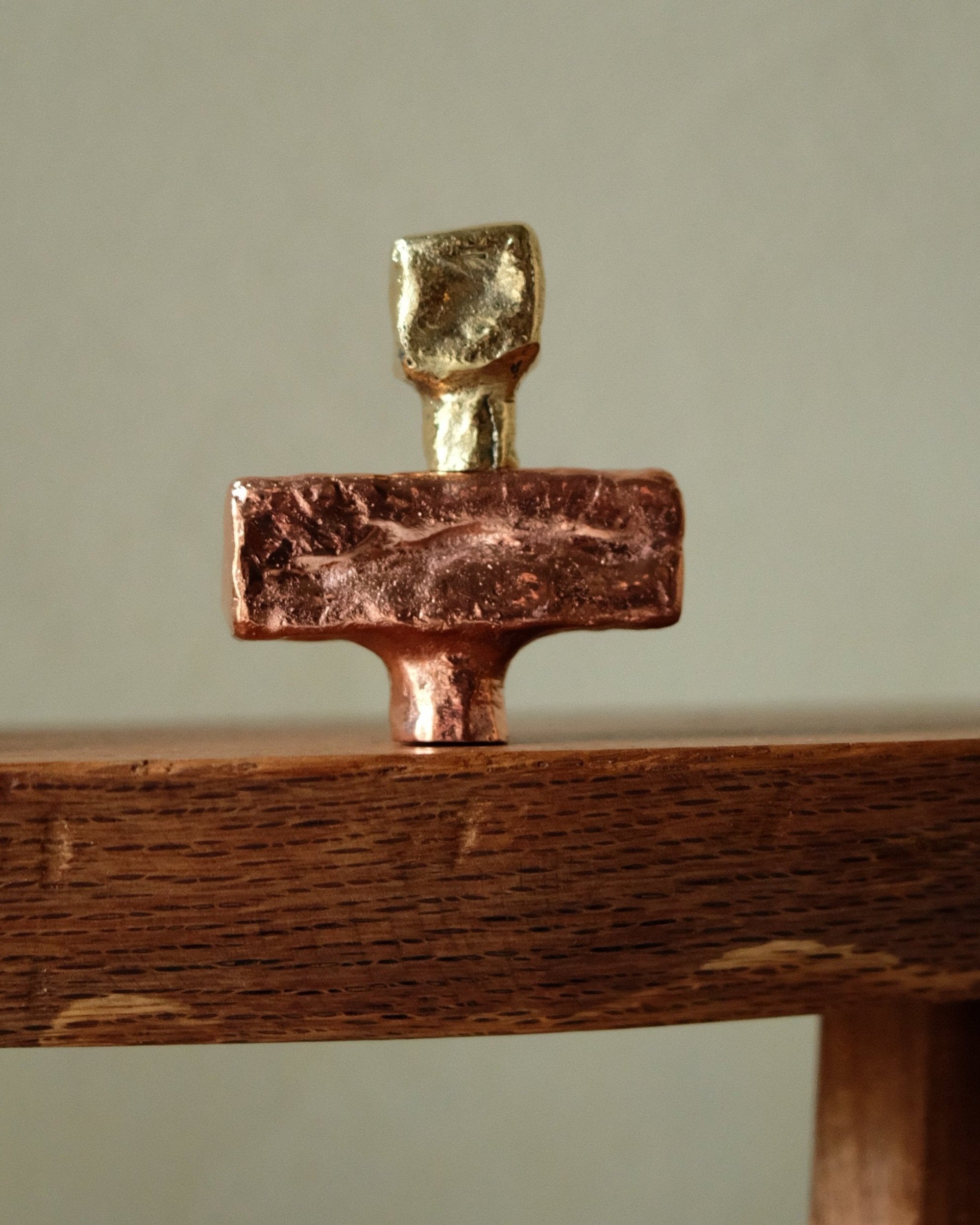 ISLE Cabinet Knob/Wall Hook Medium — close-up of copper and gold finish
