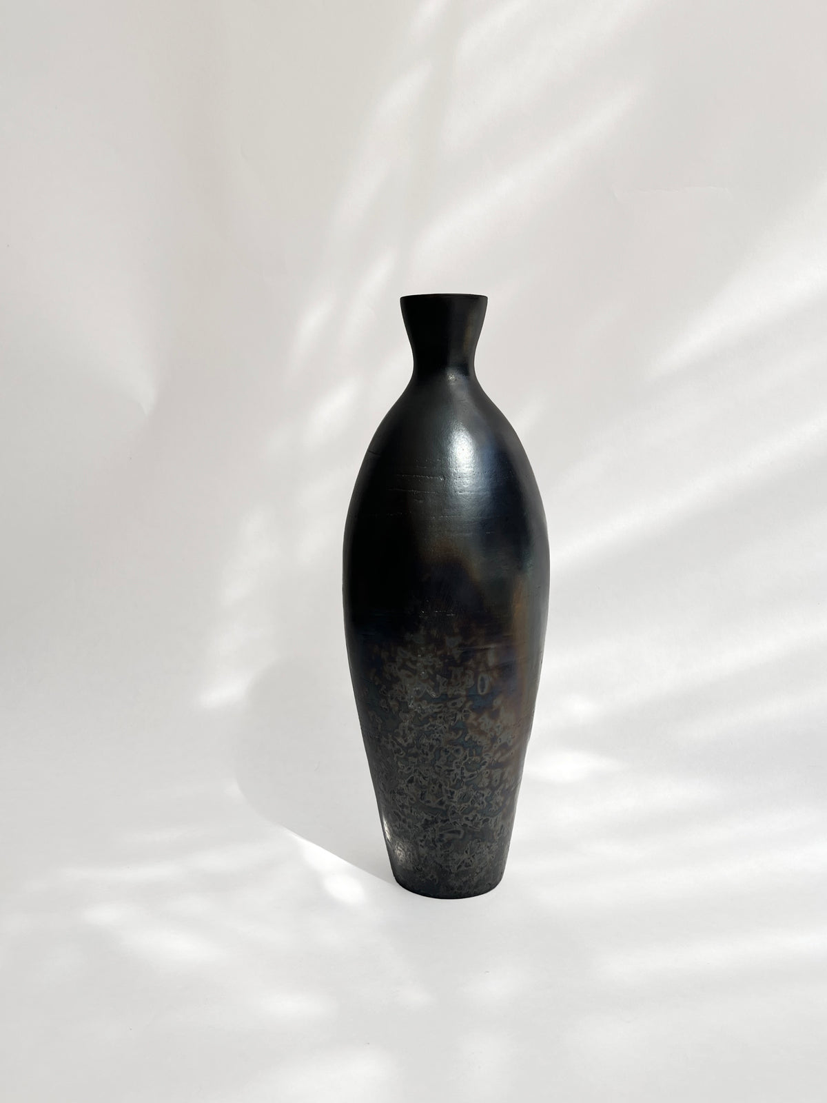 Oleum Vase – Metallic Black Raku — lifestyle setting