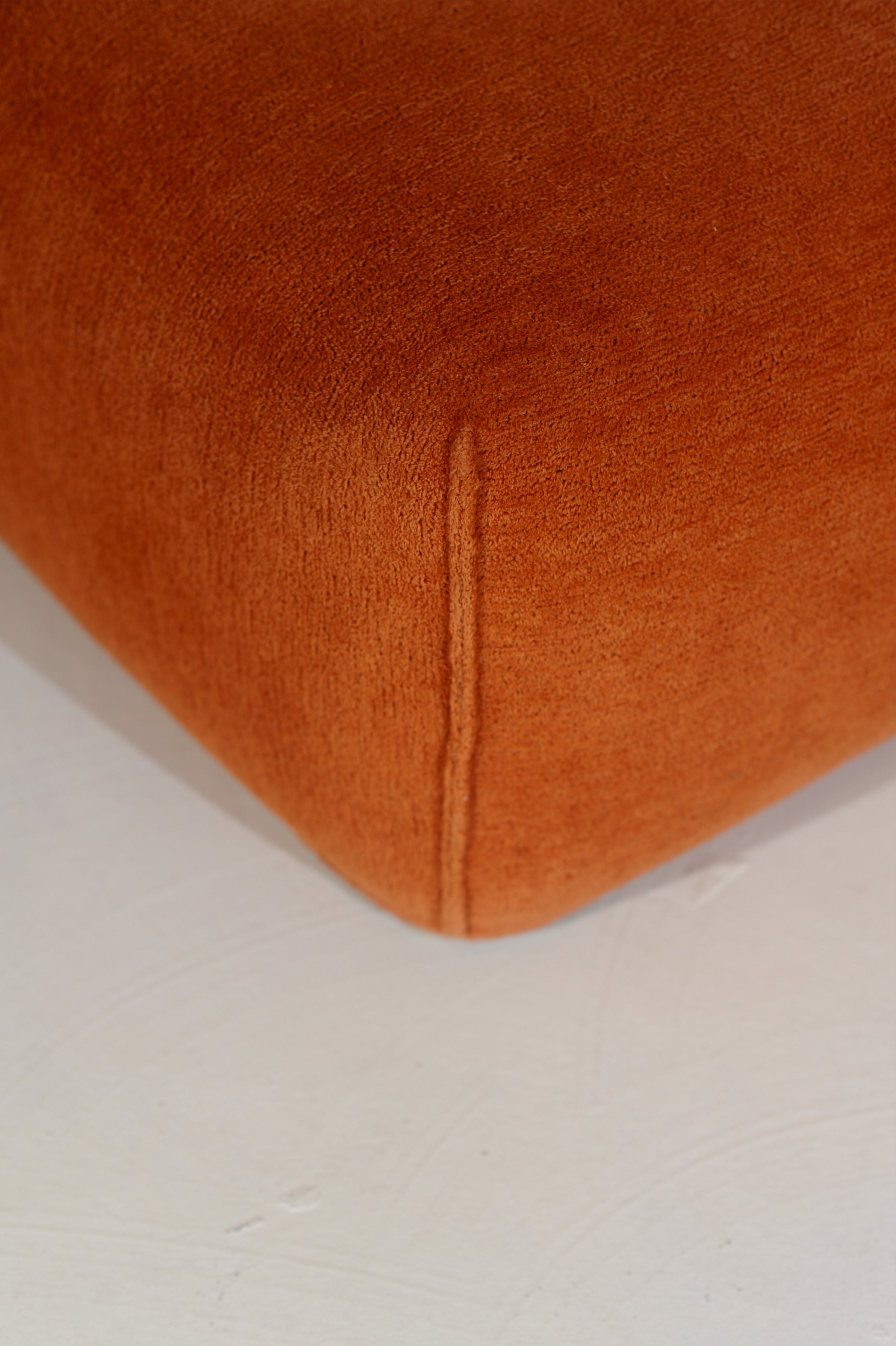 Orange leather corner detail of Le Bambole armchair by Mario Bellini