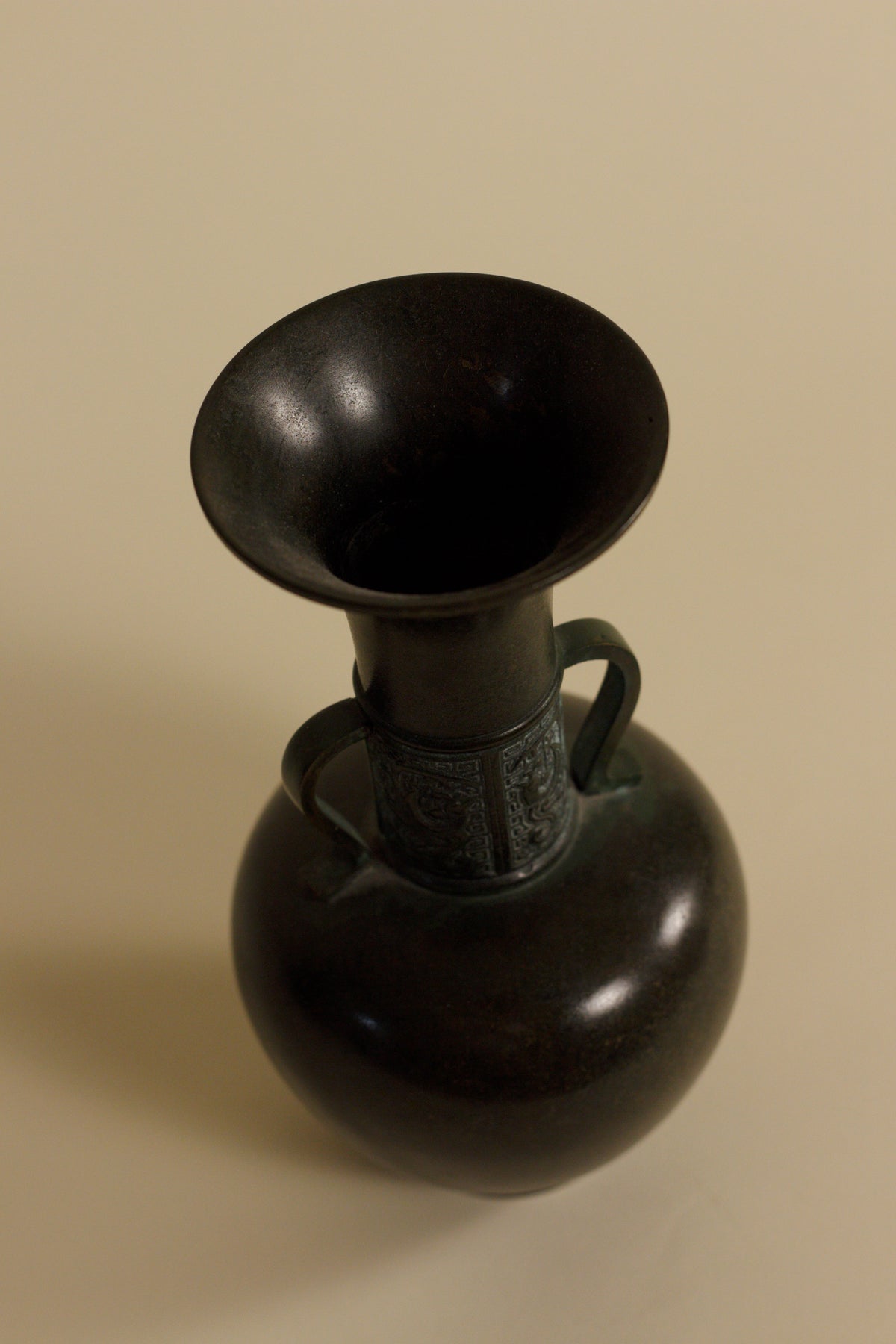 Japanese Patinated Bronze Vase – Geometric Relief Twin Handle — side angle