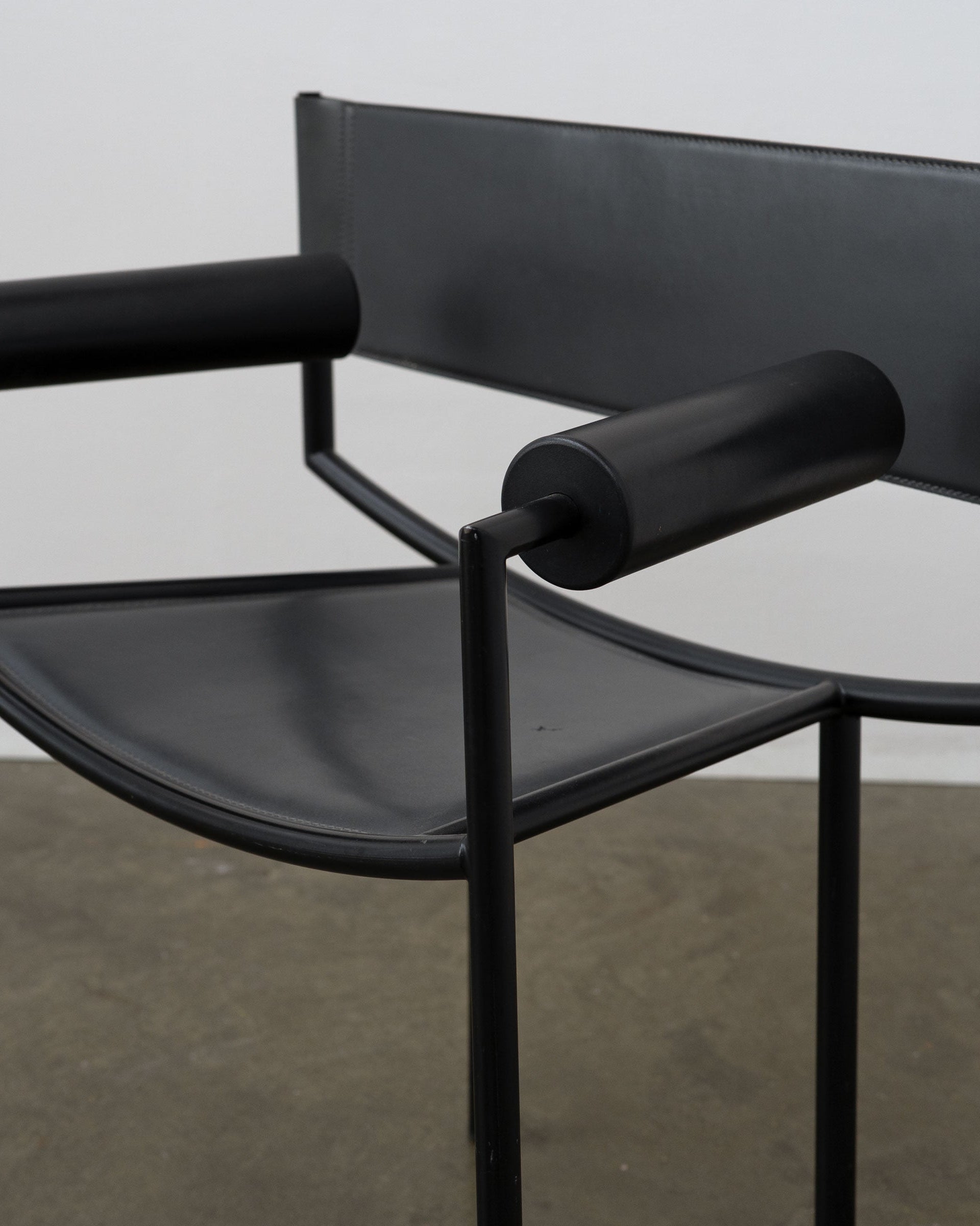Postmodern Leather and Steel Chair, 1980s — side angle showing black leather seat and armrests