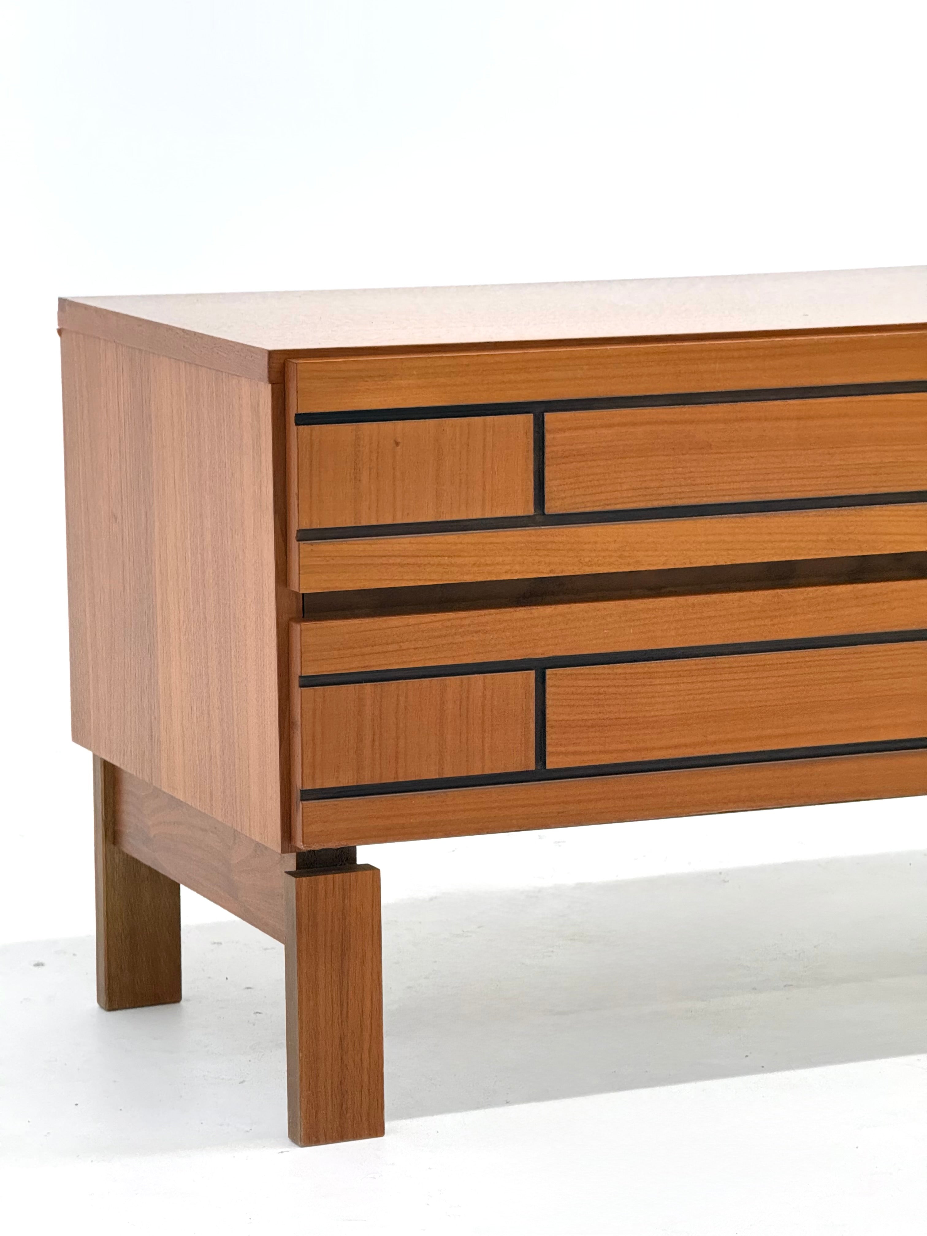 Low Italian wooden sideboard with graphic black lines — in context
