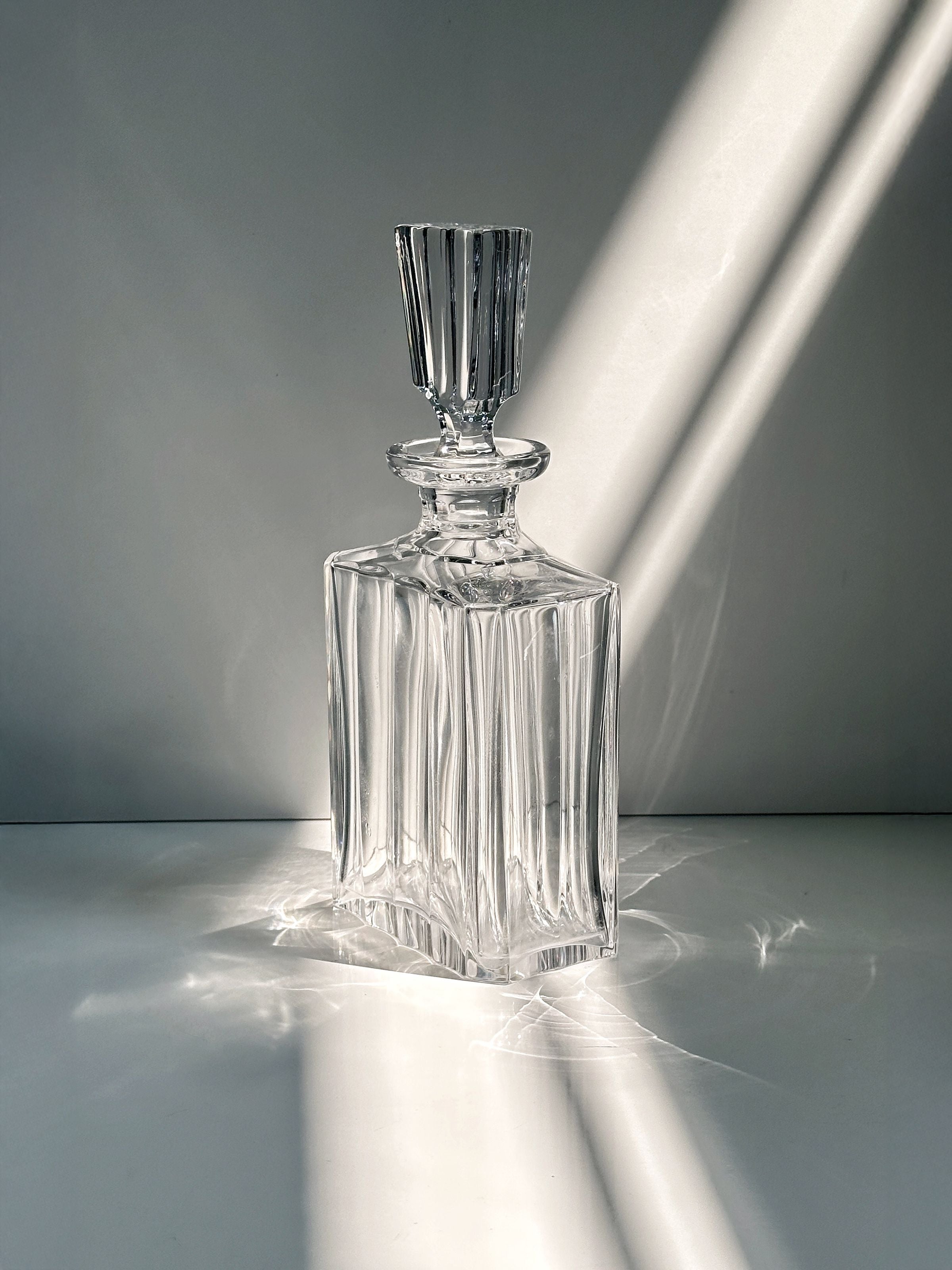 Italian Crystal Glass Decanter, 1970s — illuminated on white surface