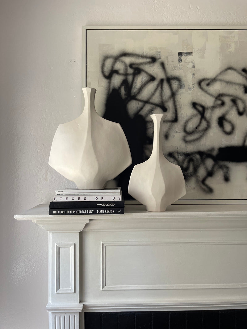 Mid-Century Modern Sculptural Vessel in White Stoneware – Small Hanè — displayed on mantel above books