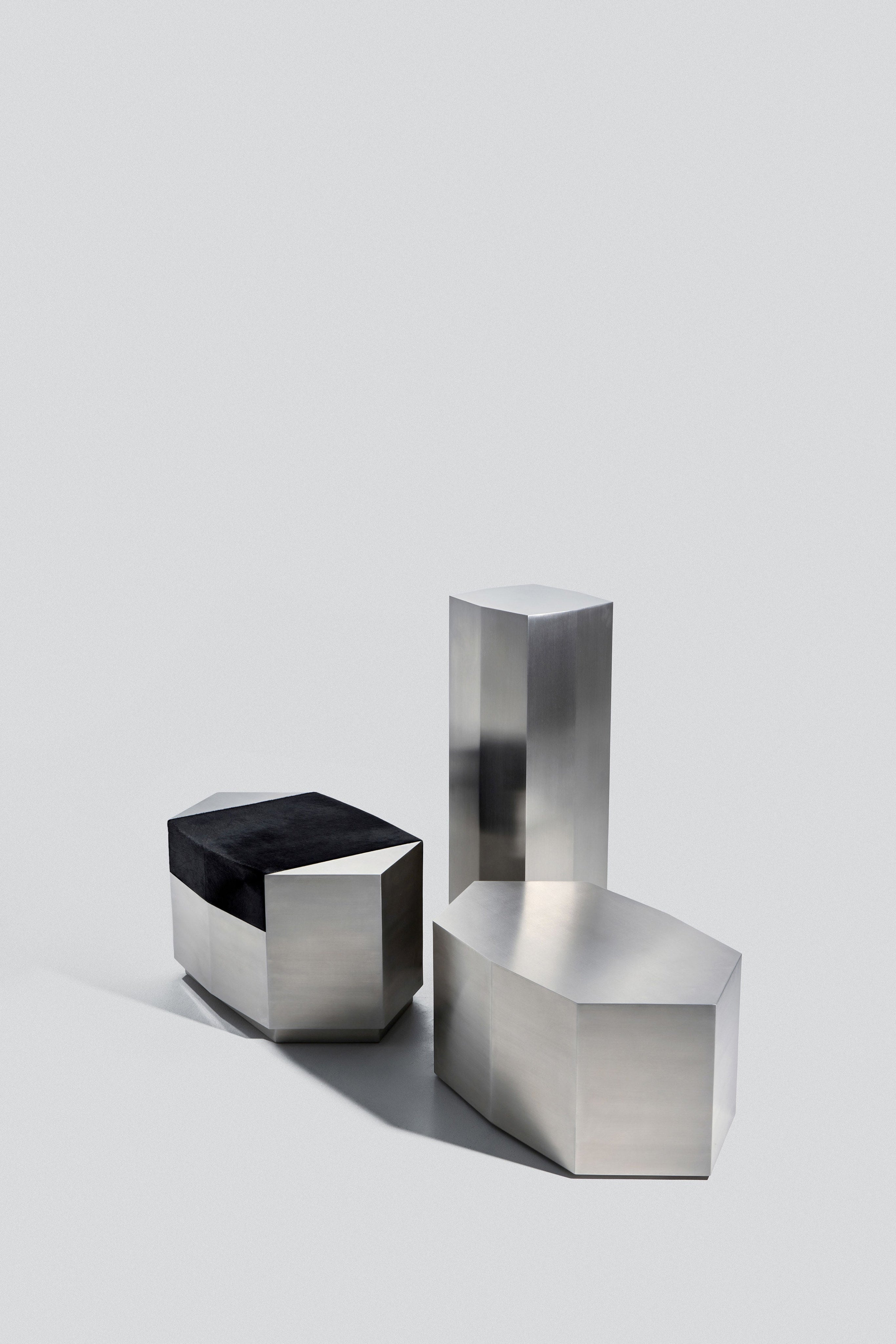 Ame II' Steel Pedestal — angled view of polished steel surfaces