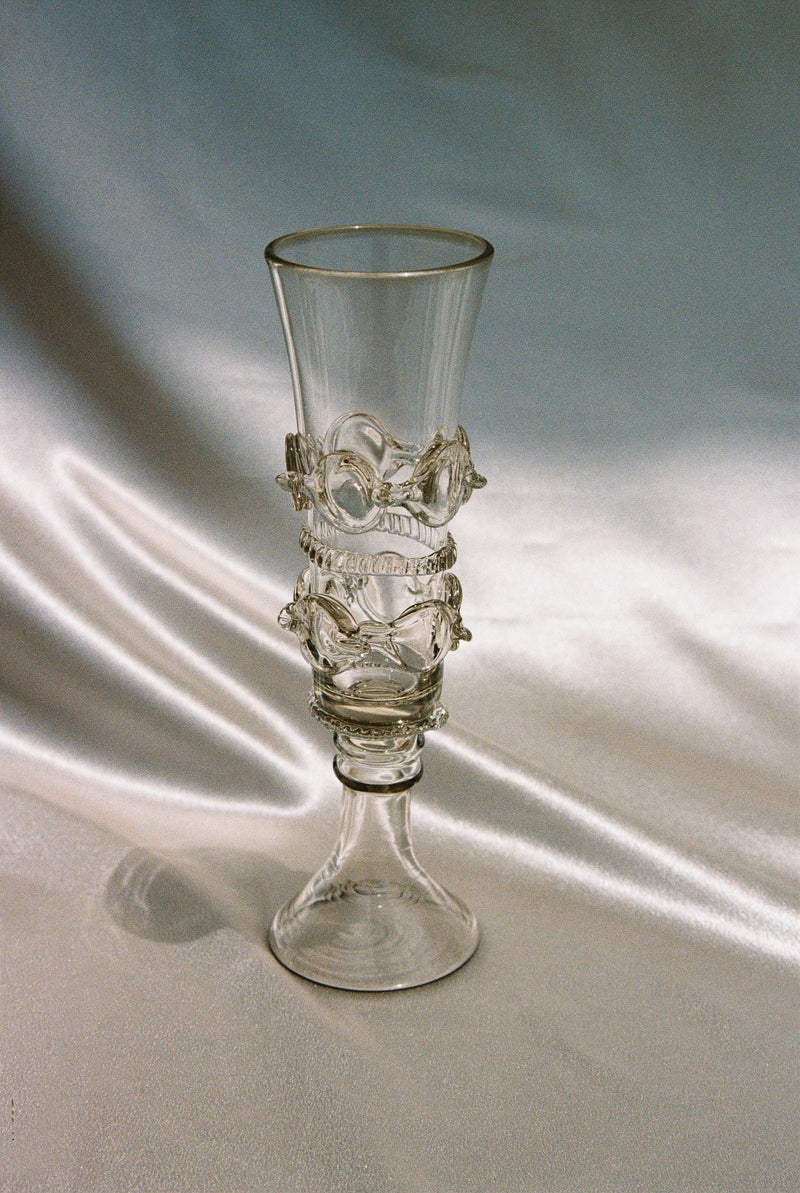 Handblown glass champagne flute with sculptural spiral stem design