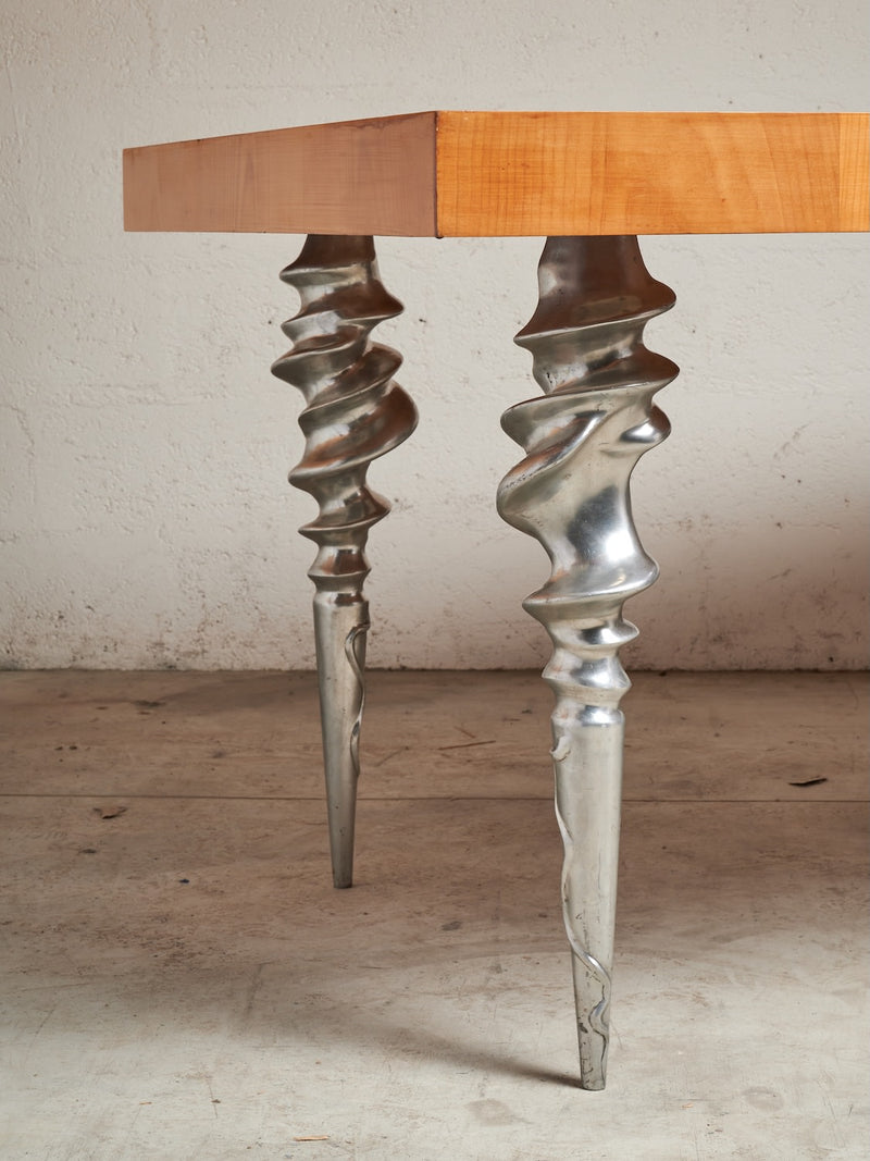 Post-Modern Table with Marquetry Top and Cast Aluminum Legs, 1980's — close-up of cast aluminum legs with twisted design