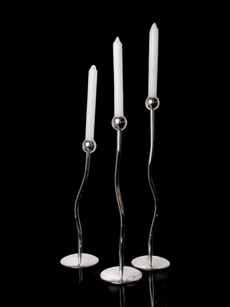 Trio of silver metal candlesticks from mesa italy, italy, 1980s — detail view