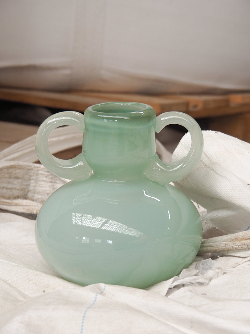 The Vase 03 — close-up of mint green glass with handles