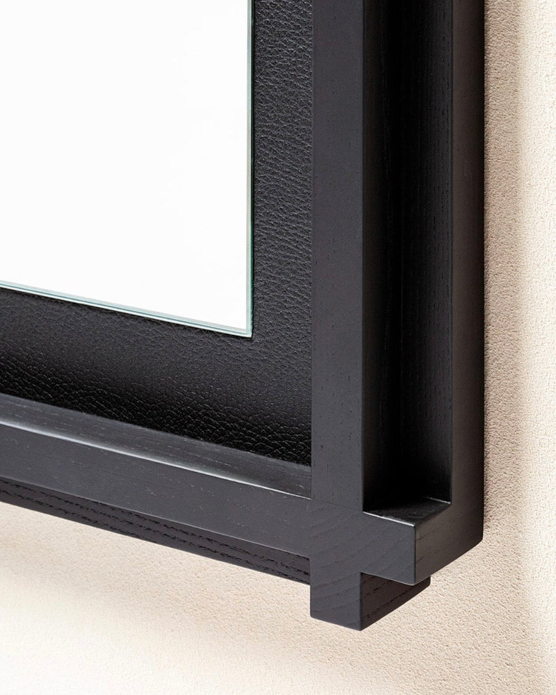 Black leather Structura mirror frame corner detail