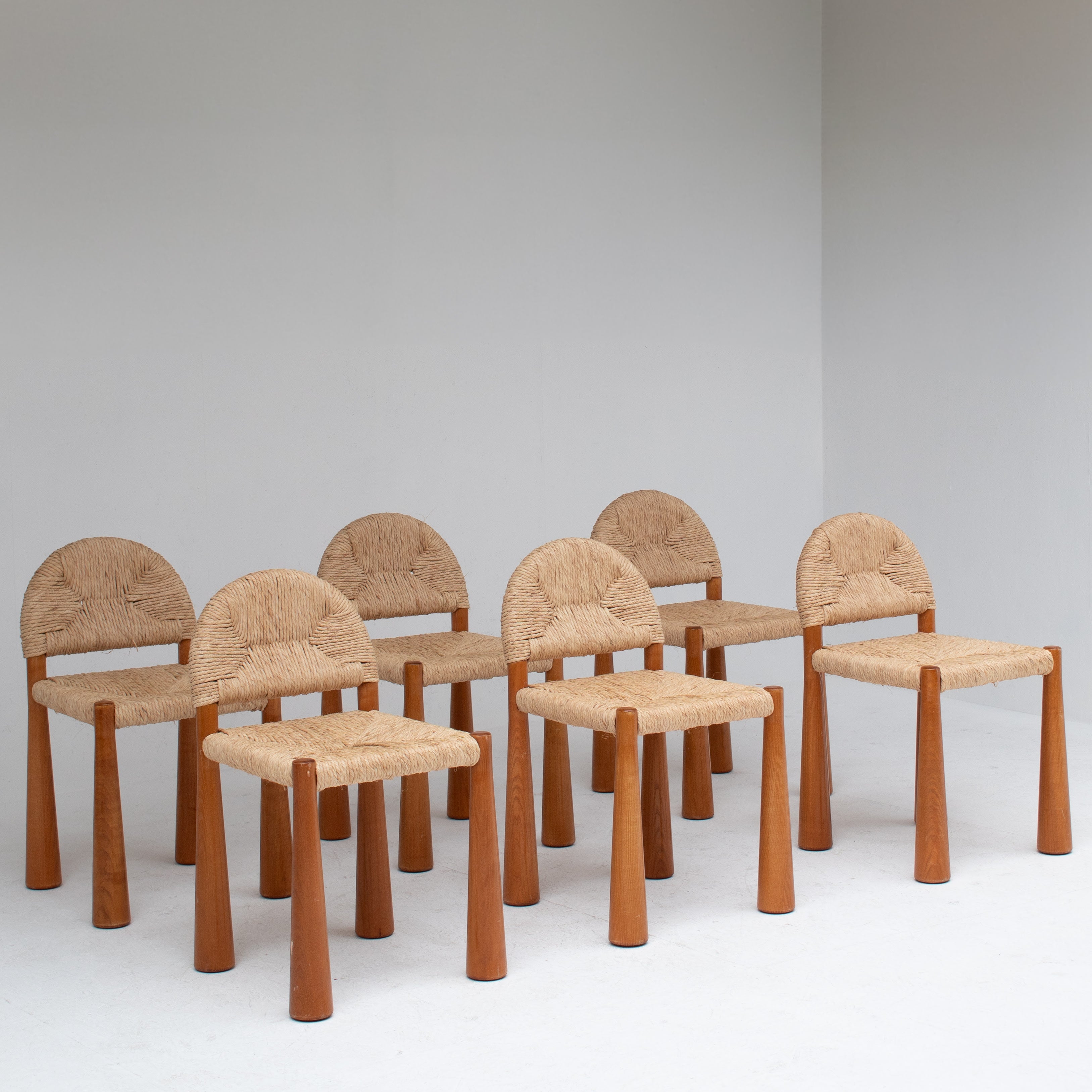 Set of 6 “Toscanolla” Dining Chairs by Alessandro Becchi for Giovannetti — side angle showing woven seats and wooden legs