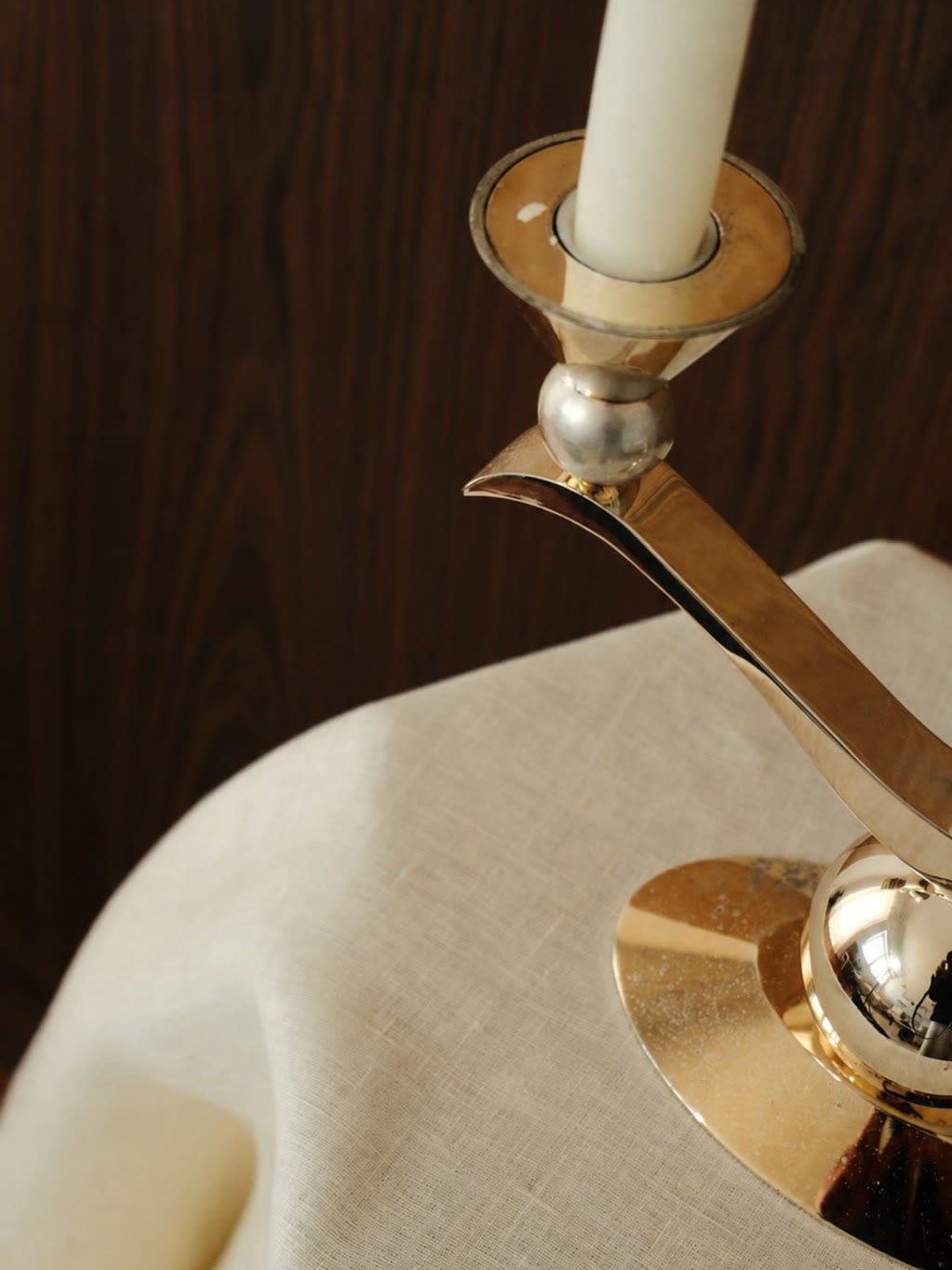 A Sculptural Silver- and Gold-Patinated Metal Candle Holder — detail view