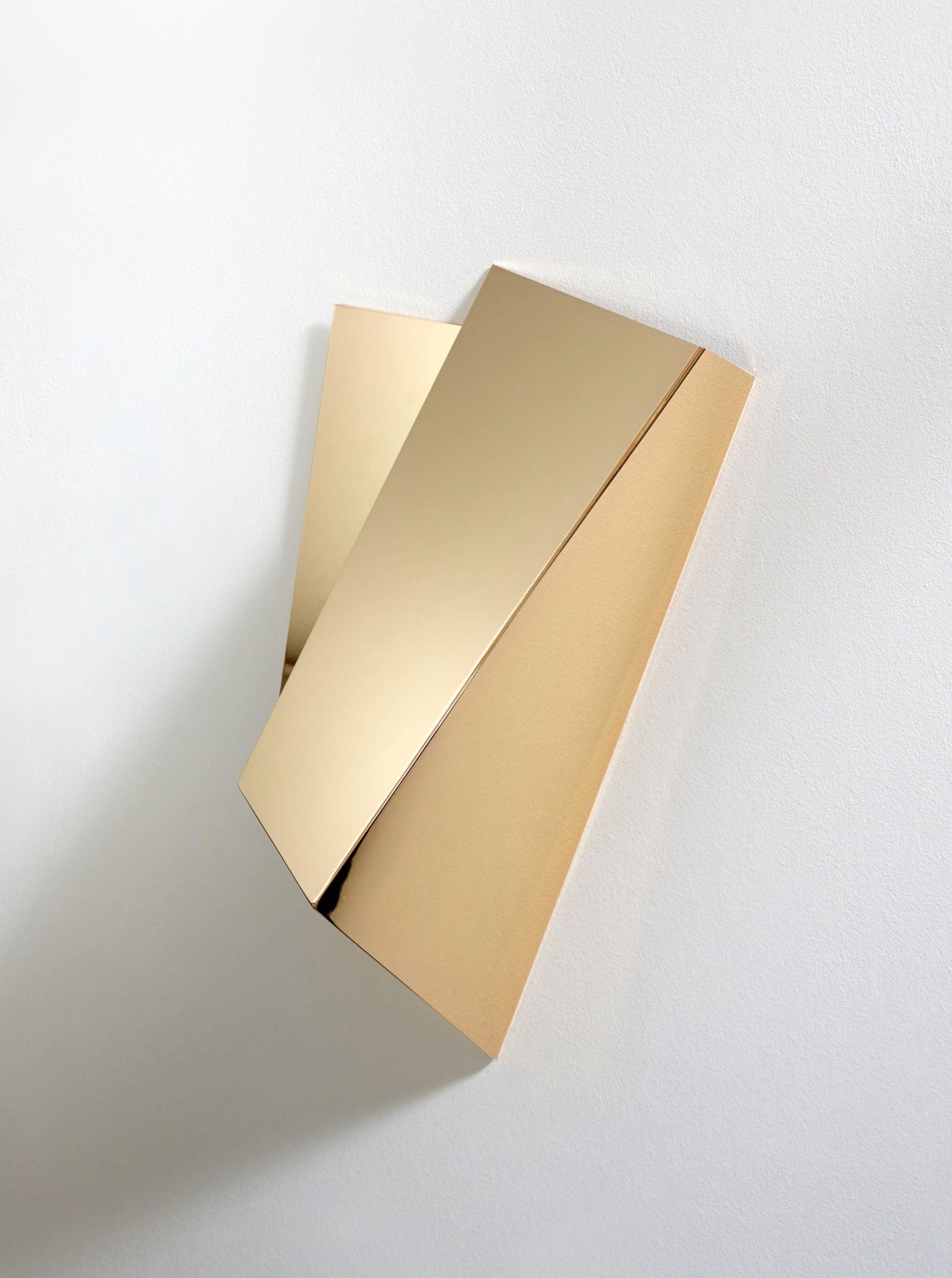 Katoptris Gold Wall Light — angled view against white wall