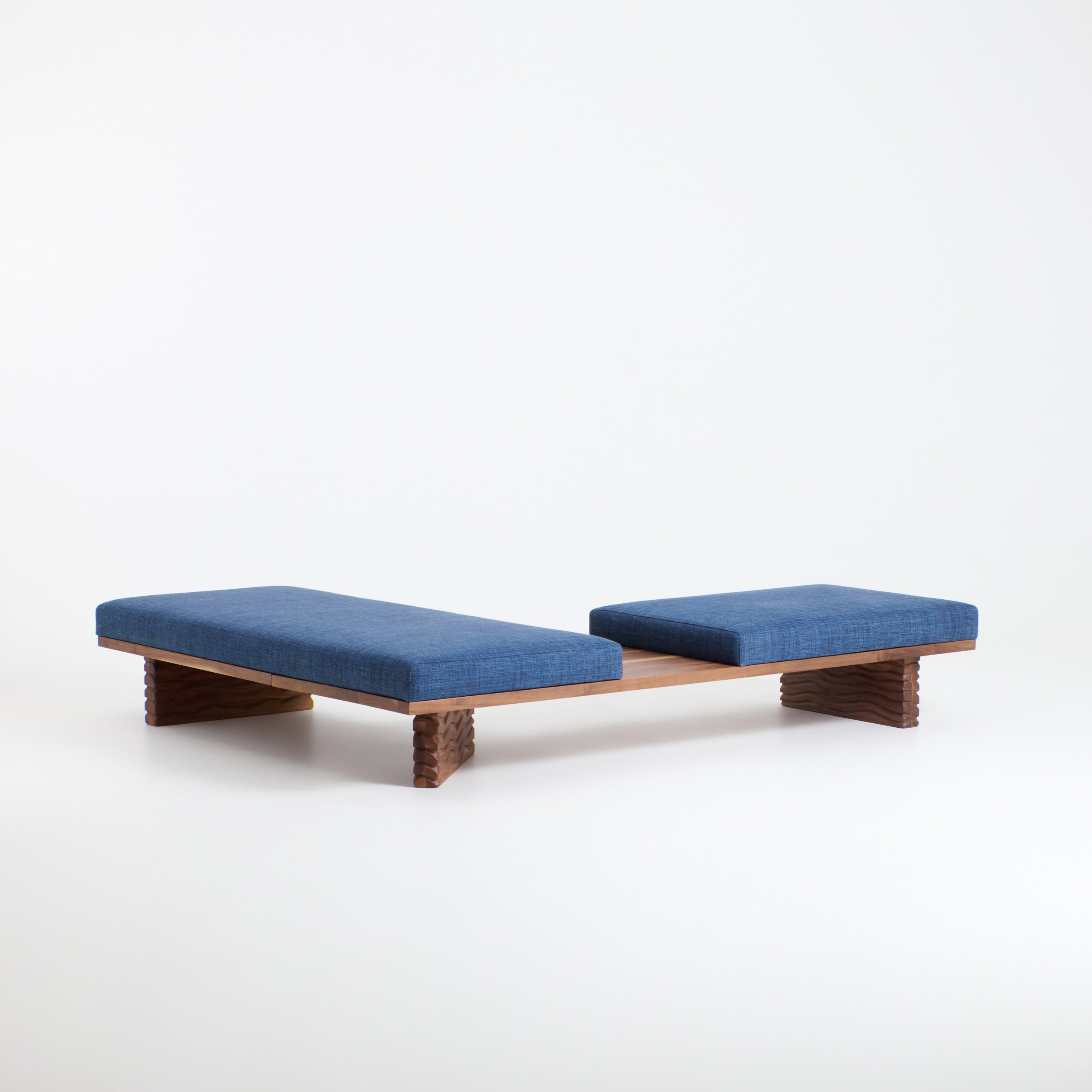 Nazaré Daybed L Shape — angled view of blue fabric cushions on wood base