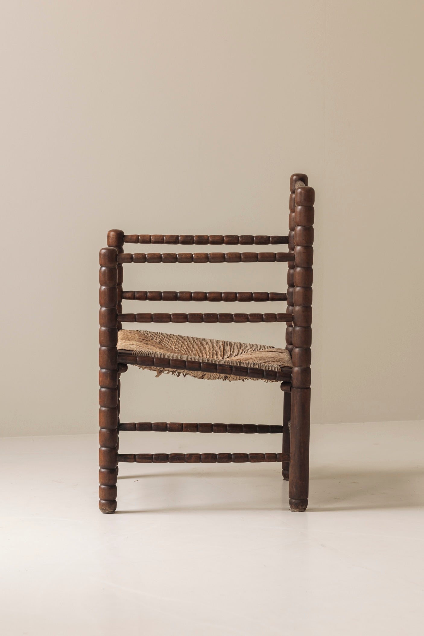 Sculptural French 'Bobbin' armchairs, 1950s — lifestyle setting