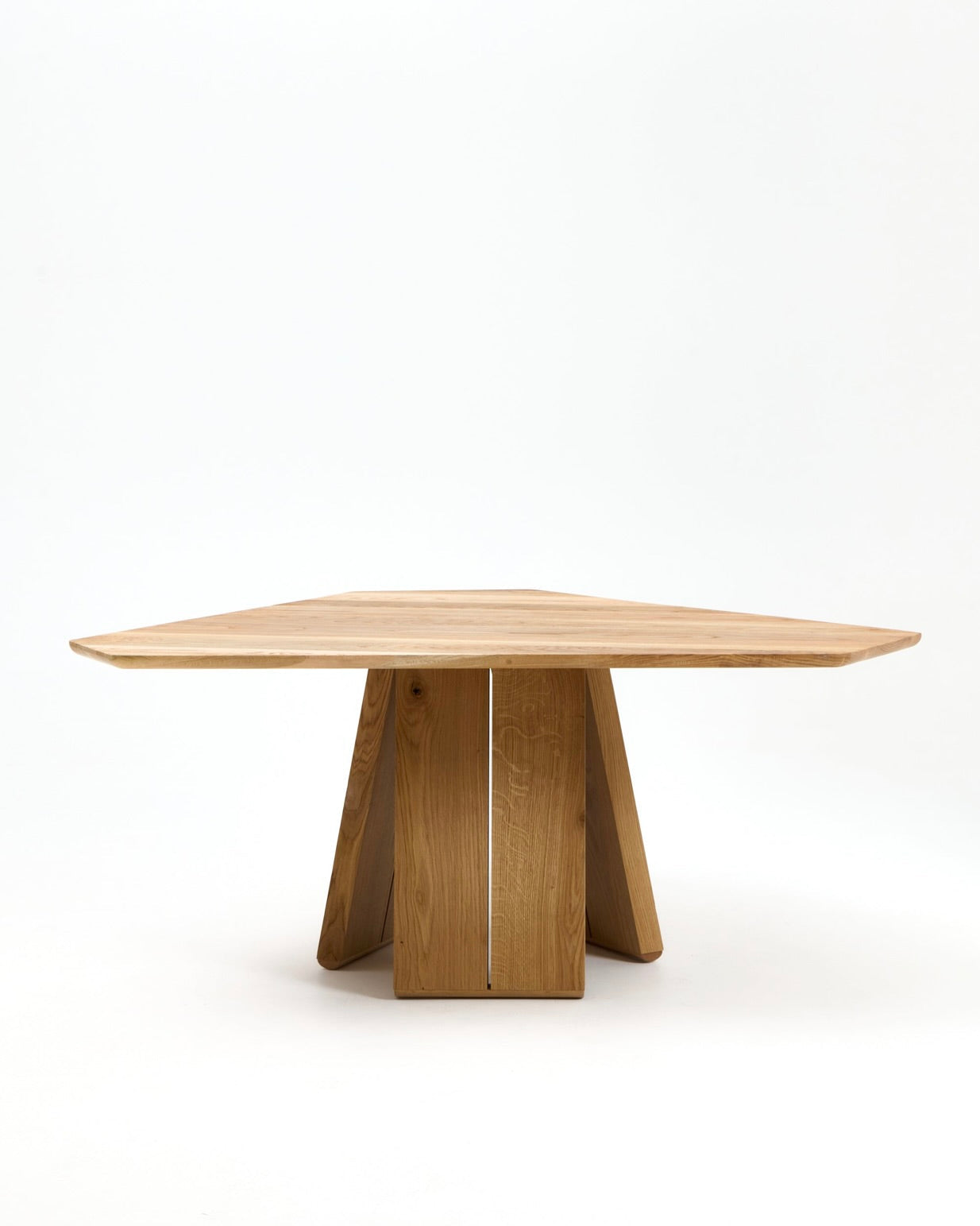 Perícia Dining Table — angled view of natural wood finish