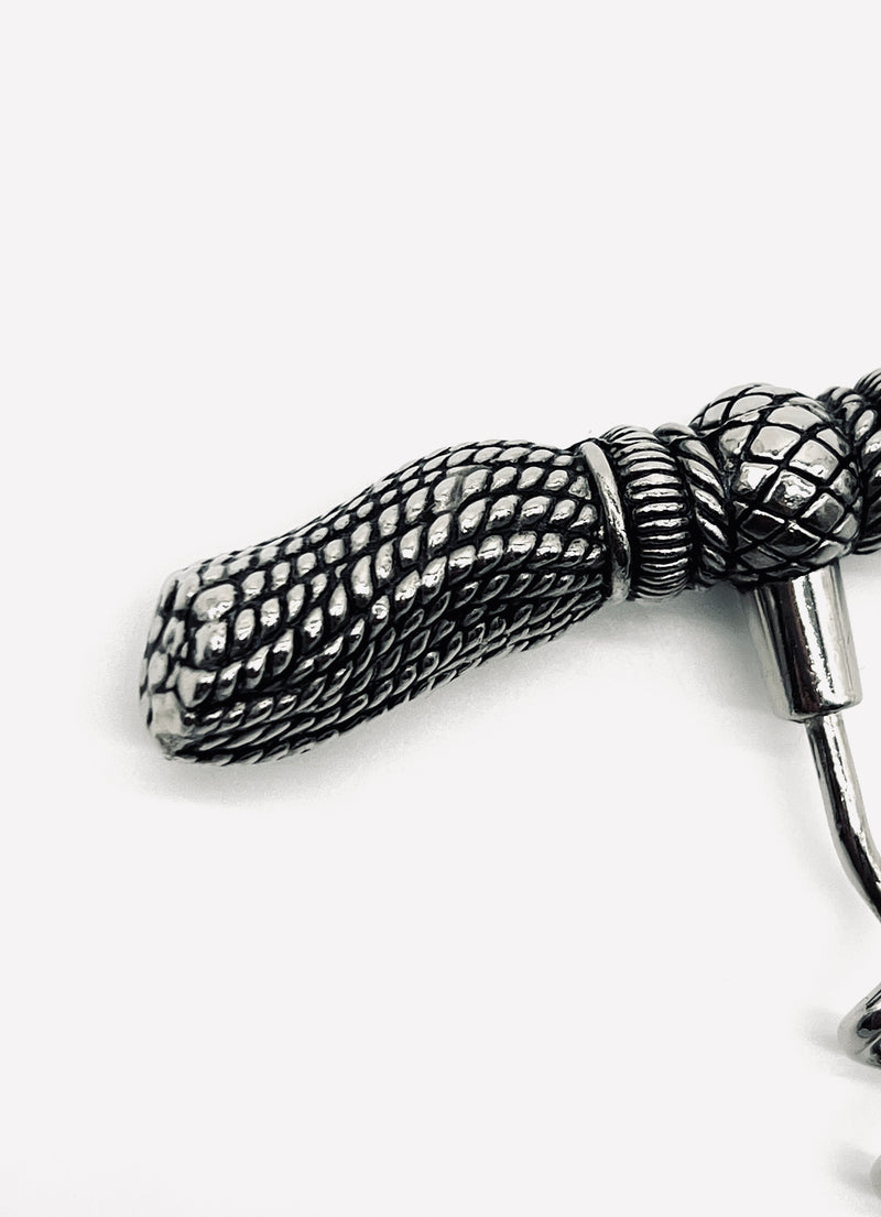 Detailed view of vintage silver-plated corkscrew tassel mechanism