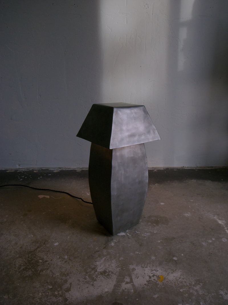 Tall hammered steel table lamp with geometric shade by Jesse Butterfield