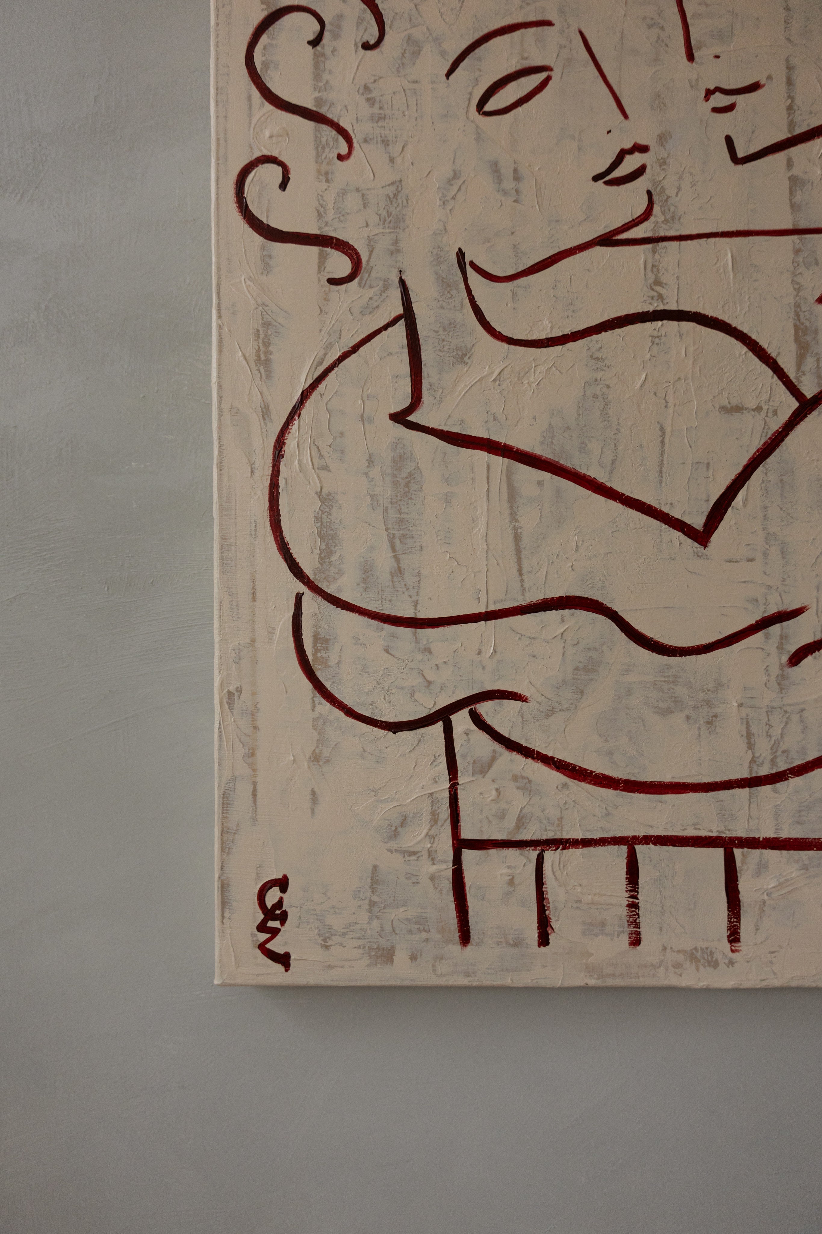 Le Cocoon — side angle showing textured cream canvas with red lines
