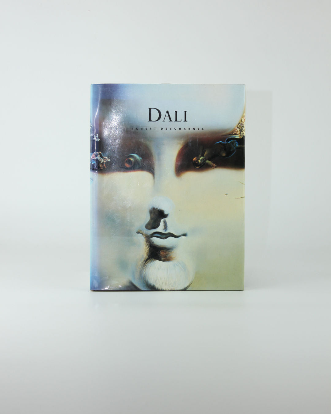 Dali Book — front cover with soft pastel colors and face illustration