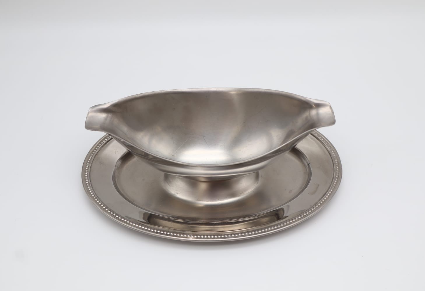 Vintage Guy Degrenne Stainless Steel Gravy Boat with Fixed Saucer (c. 1970) — lifestyle setting