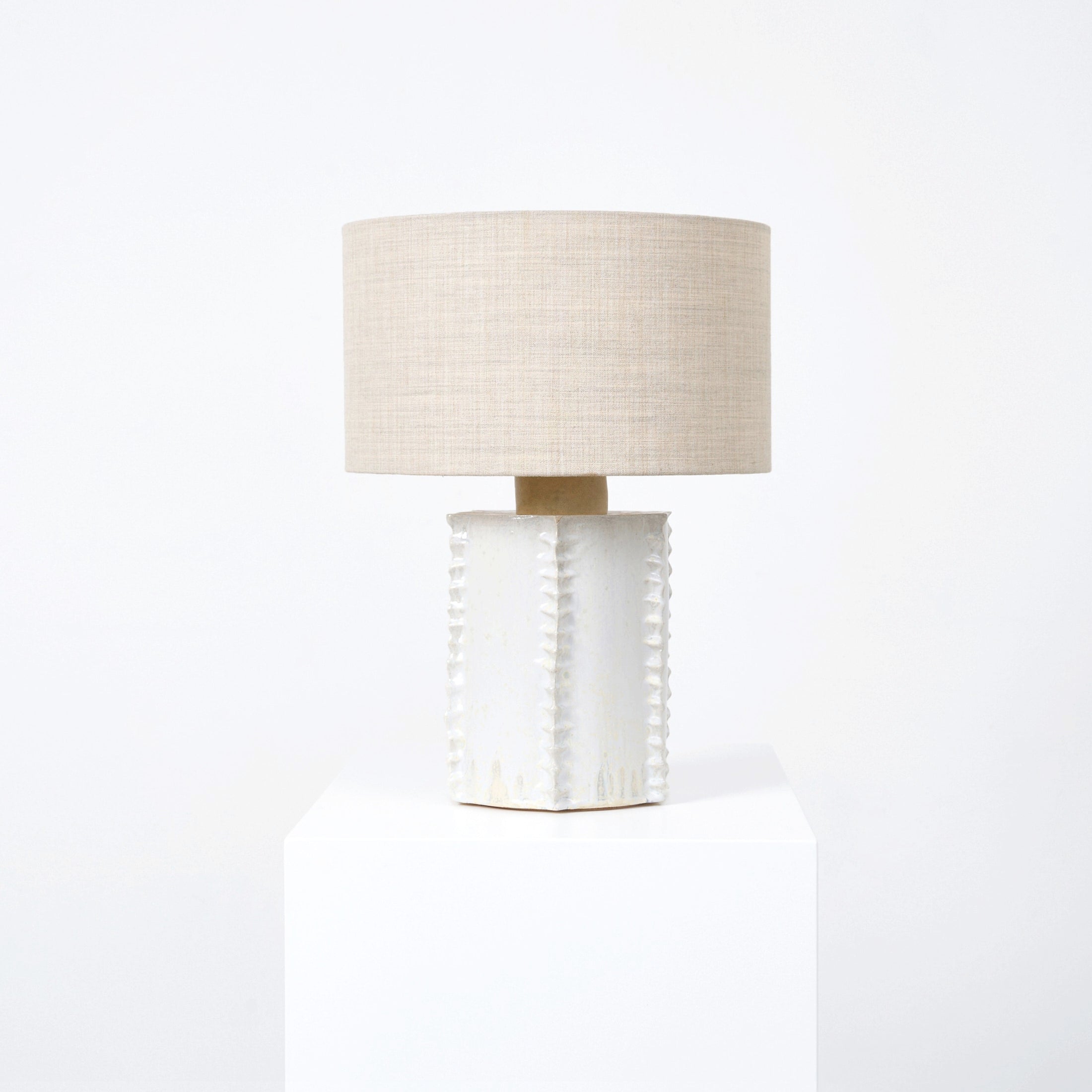 Totem Table Light — back view of textured white ceramic base
