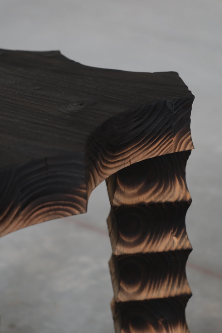 The Spiky Stool — close-up of textured black wood edge