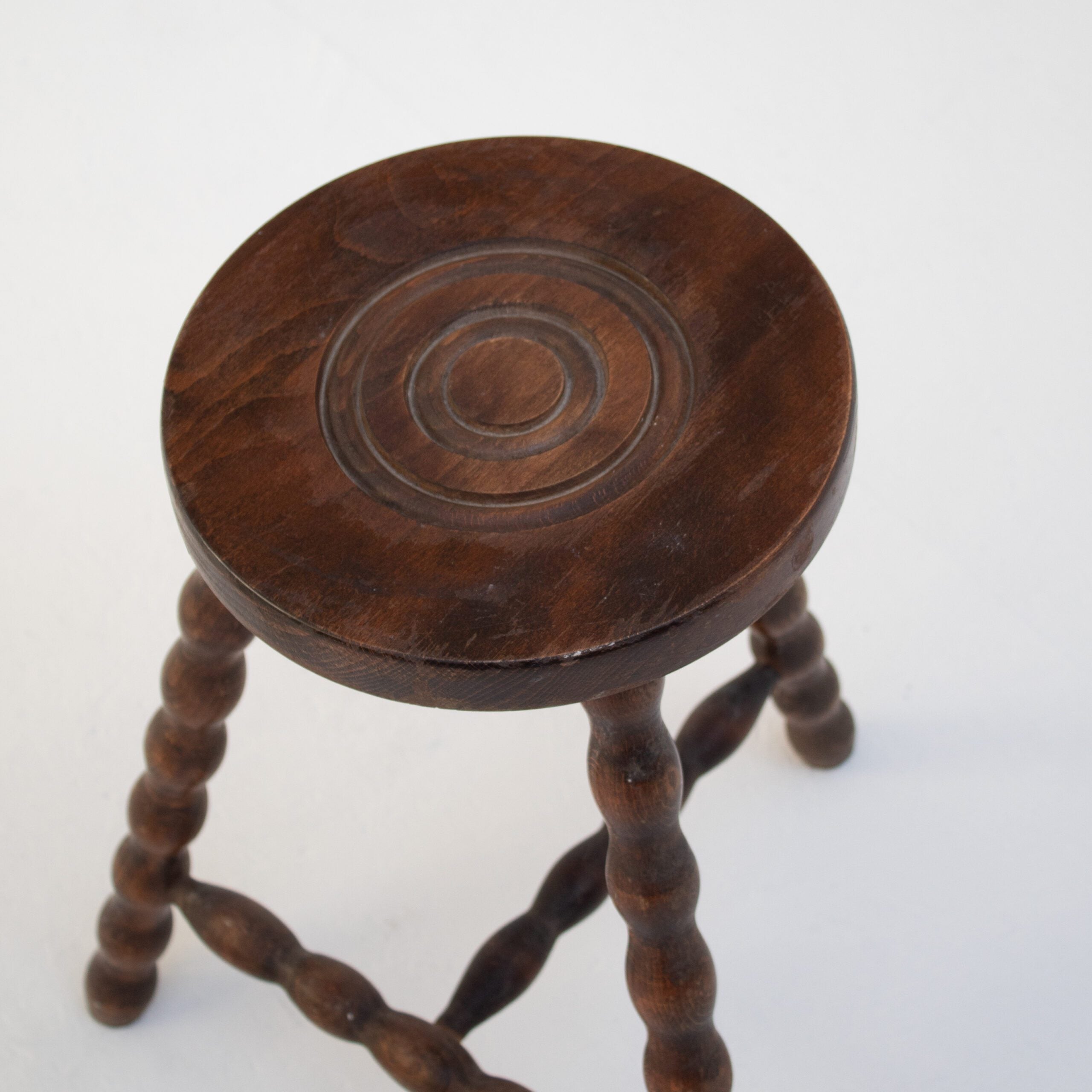 Pair of Vintage Wooden Bobbin Stools — top view of round wooden seat