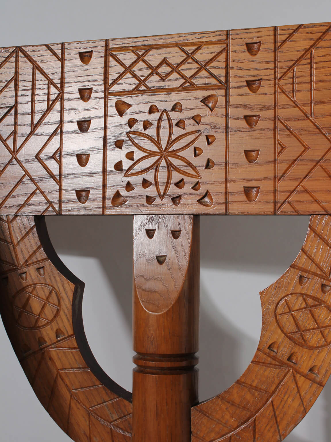 Swedish Carved Oak Monk Chair — close-up of intricate carved oak backrest