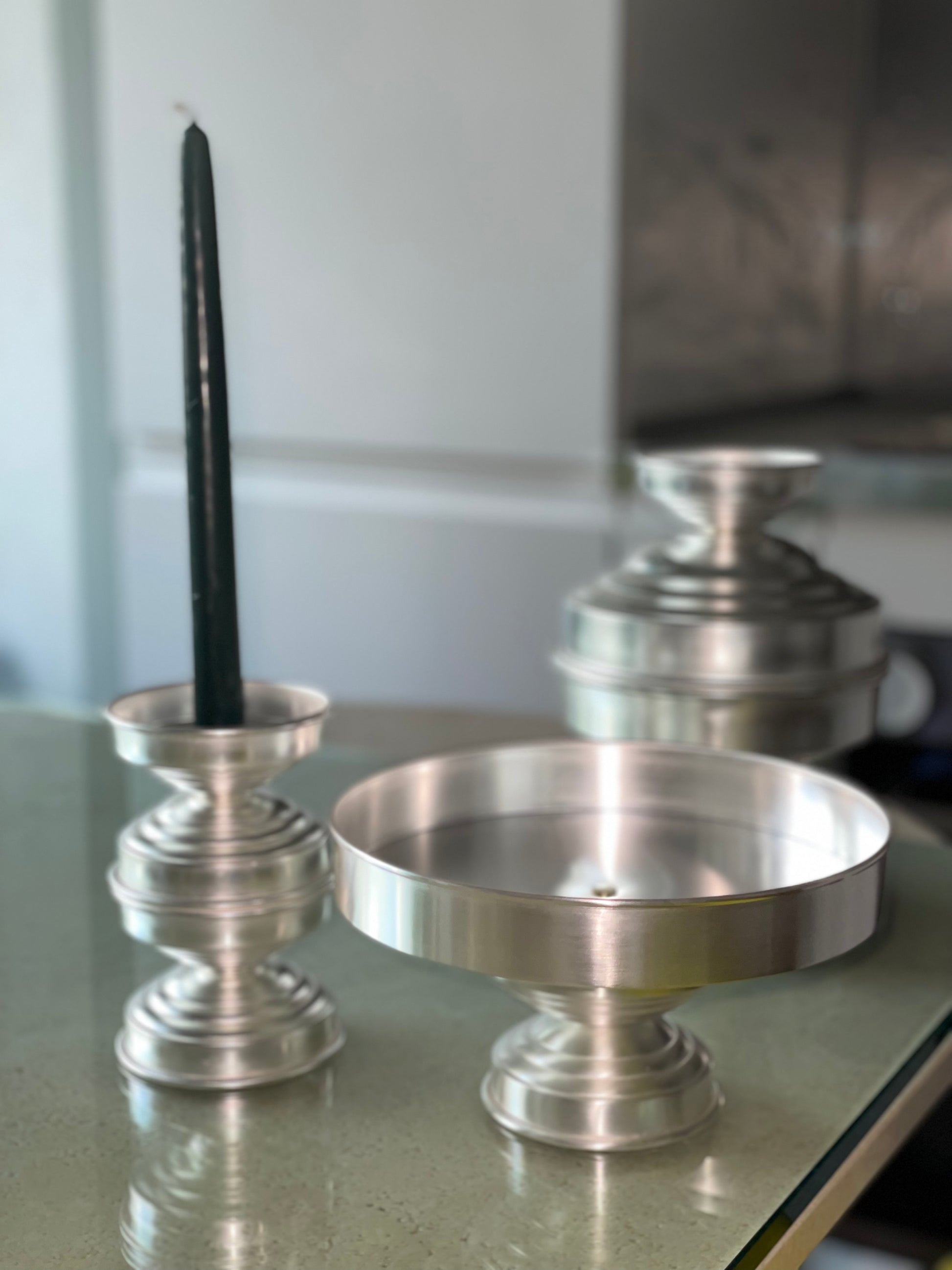 Silver Plated Candle Holders in Brass — back view on glass table