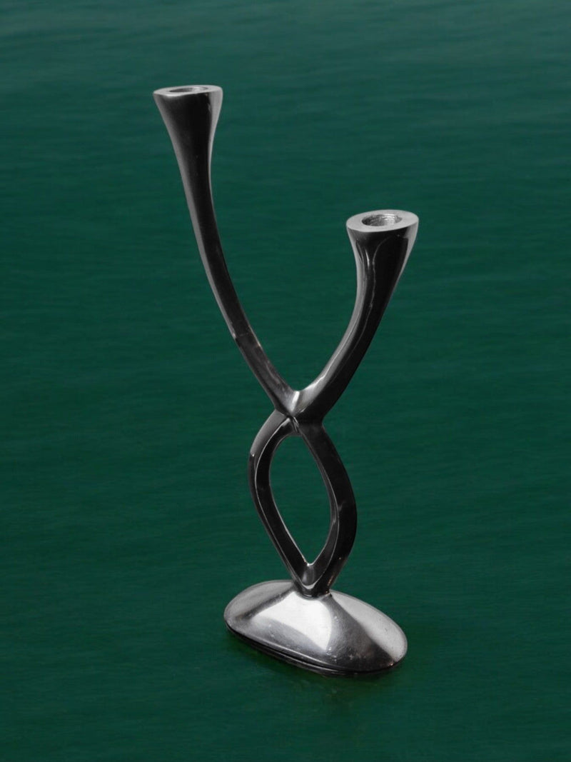 Candleholder by Matthew Hilton, England, 1980s — close-up of polished metal design