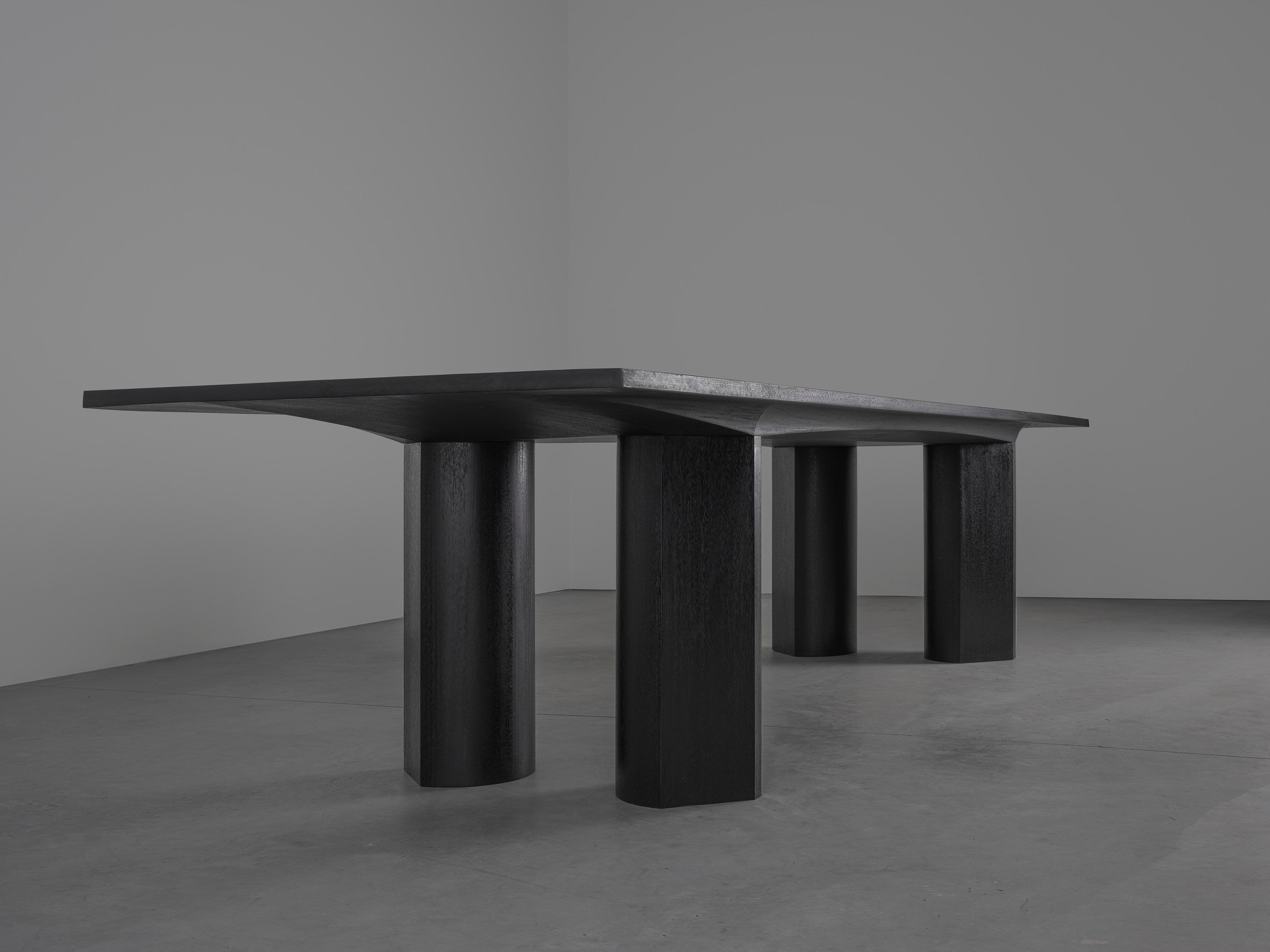 Corps - Dining Table — angled view highlighting black wooden legs