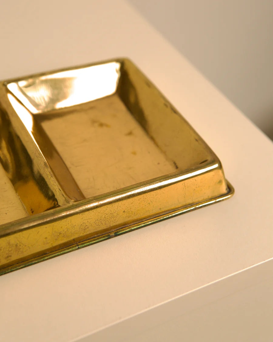 Golden brass Gucci vide-poche showing interior compartment detail