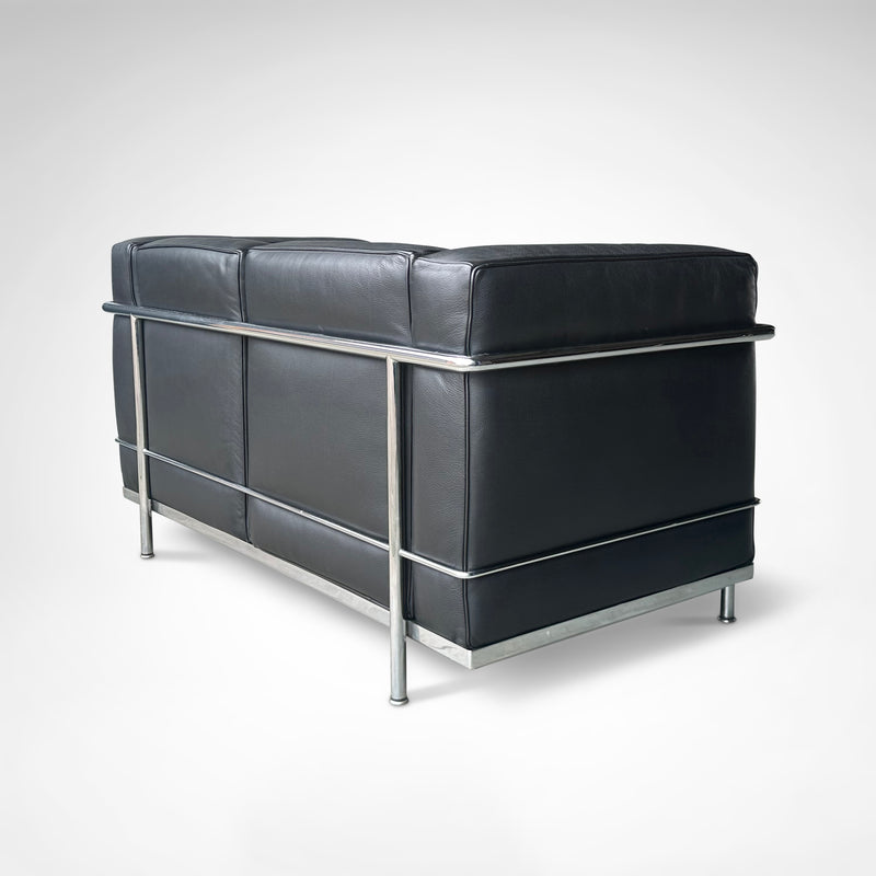 LC2 2-seater sofa by Le Corbusier et al. for Cassina 1990s — rear view highlighting black leather upholstery and chrome frame