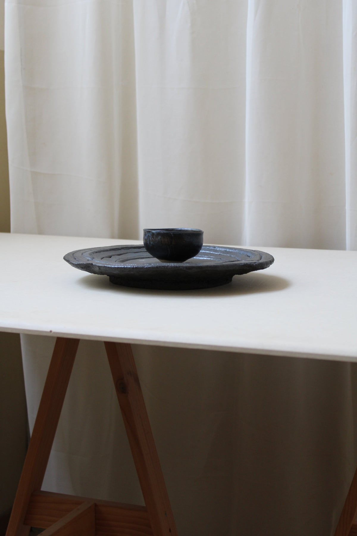 PLAT / SPIRAL NOIR — lifestyle setting