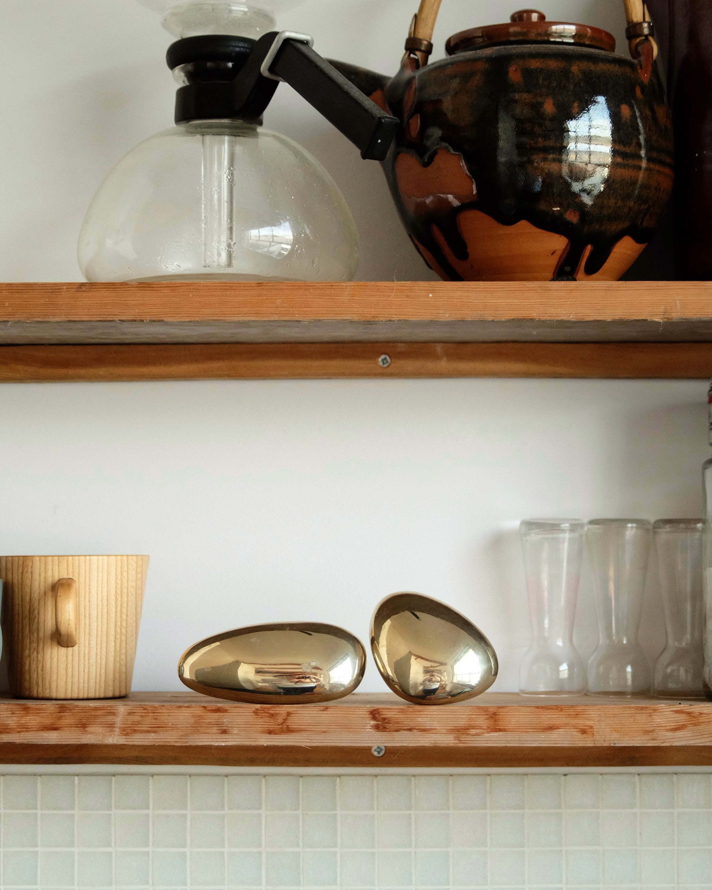 MOMI Cabinet Knob/Wall Hook Long Mini — brass knobs on wooden shelf in kitchen