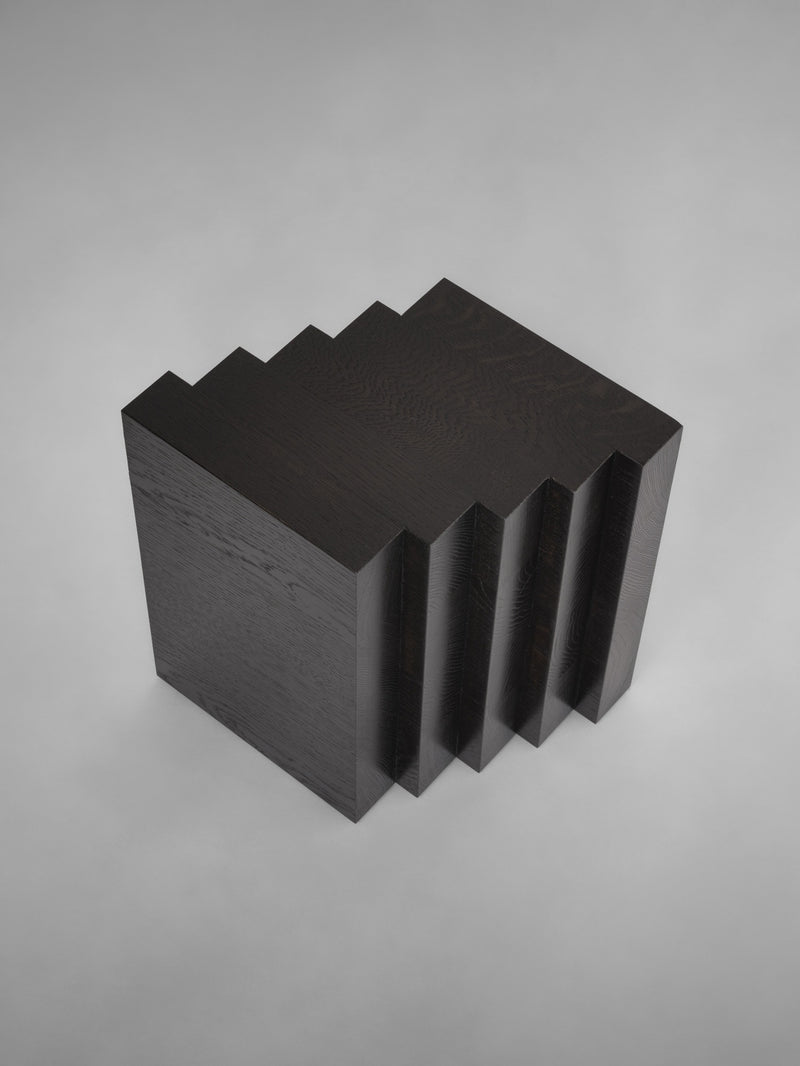 Scalae Side Table — top view of black wood with layered design