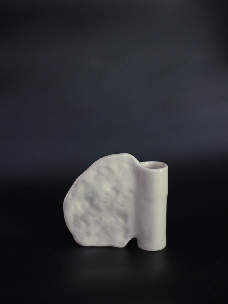 Candleholder in Stoneware with wing — close-up of textured white surface