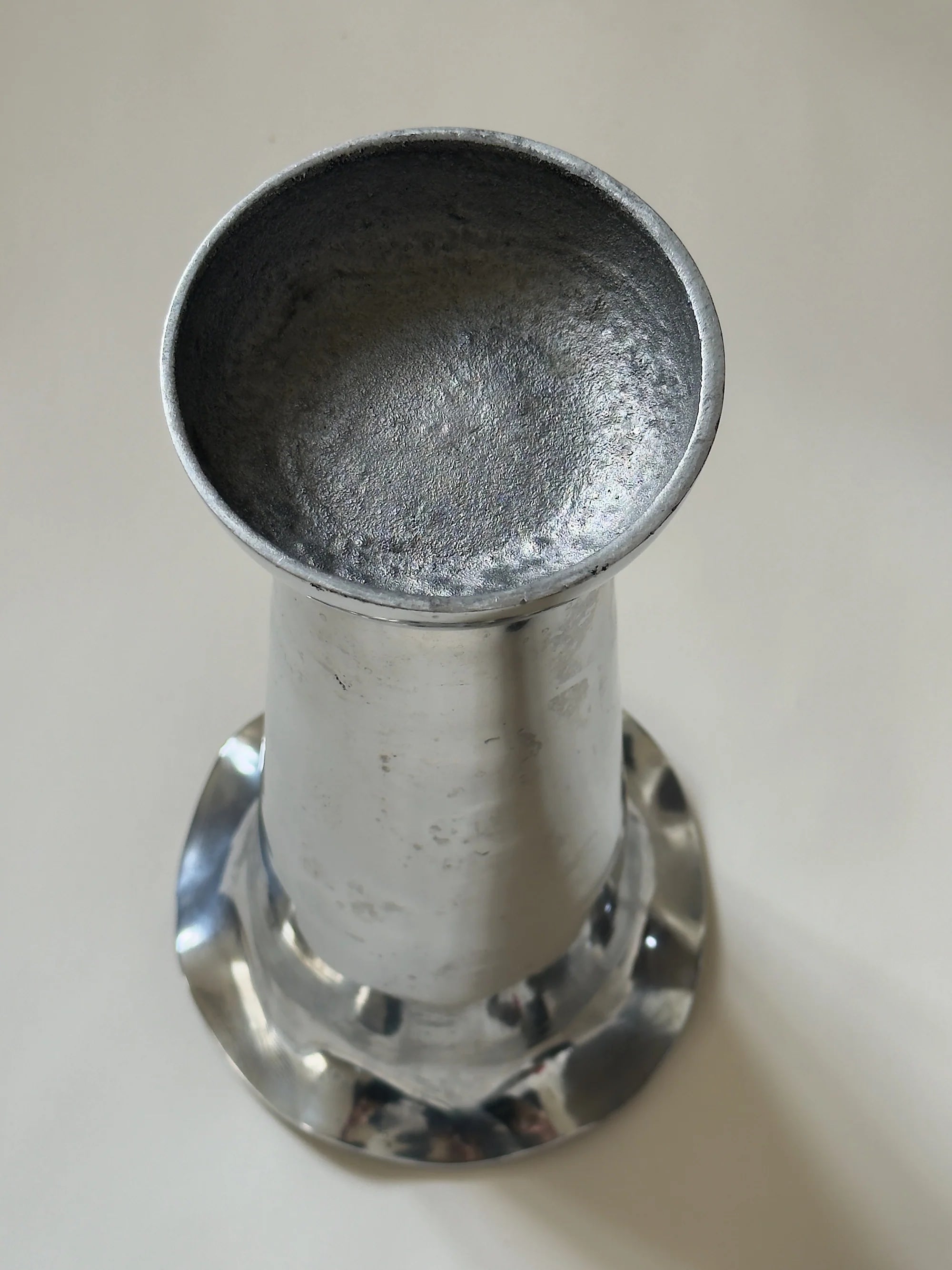 Tall Sculptural Trumpet Vase with Scalloped Rim — top view of polished metal finish