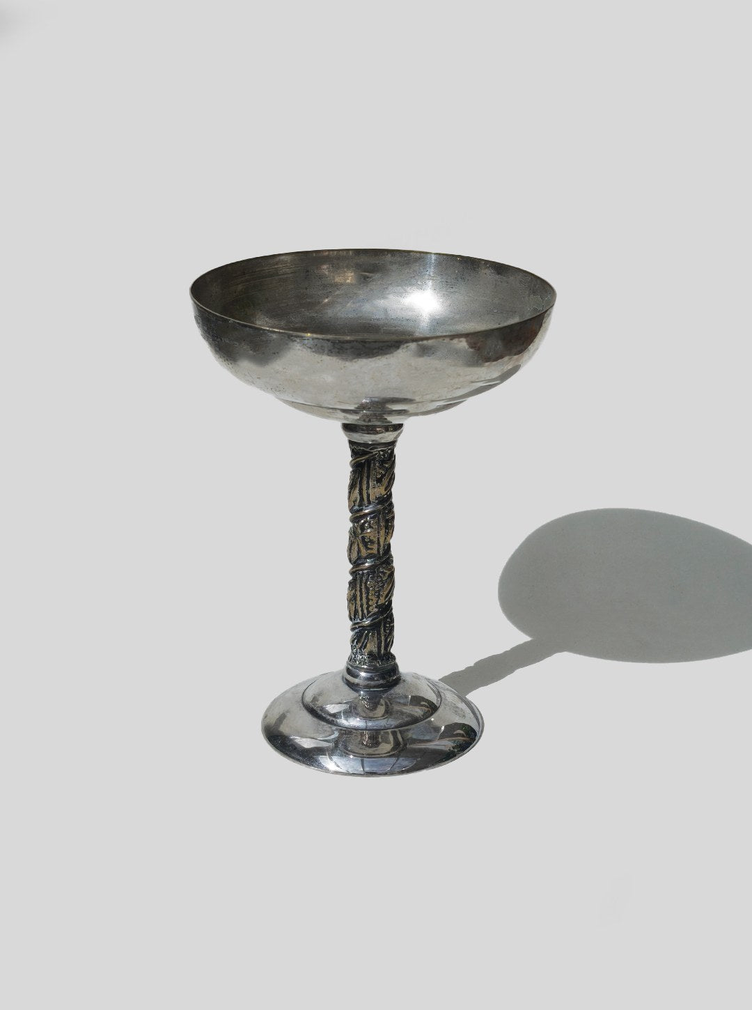 Ornate glass serving cup with decorative twisted stem detail