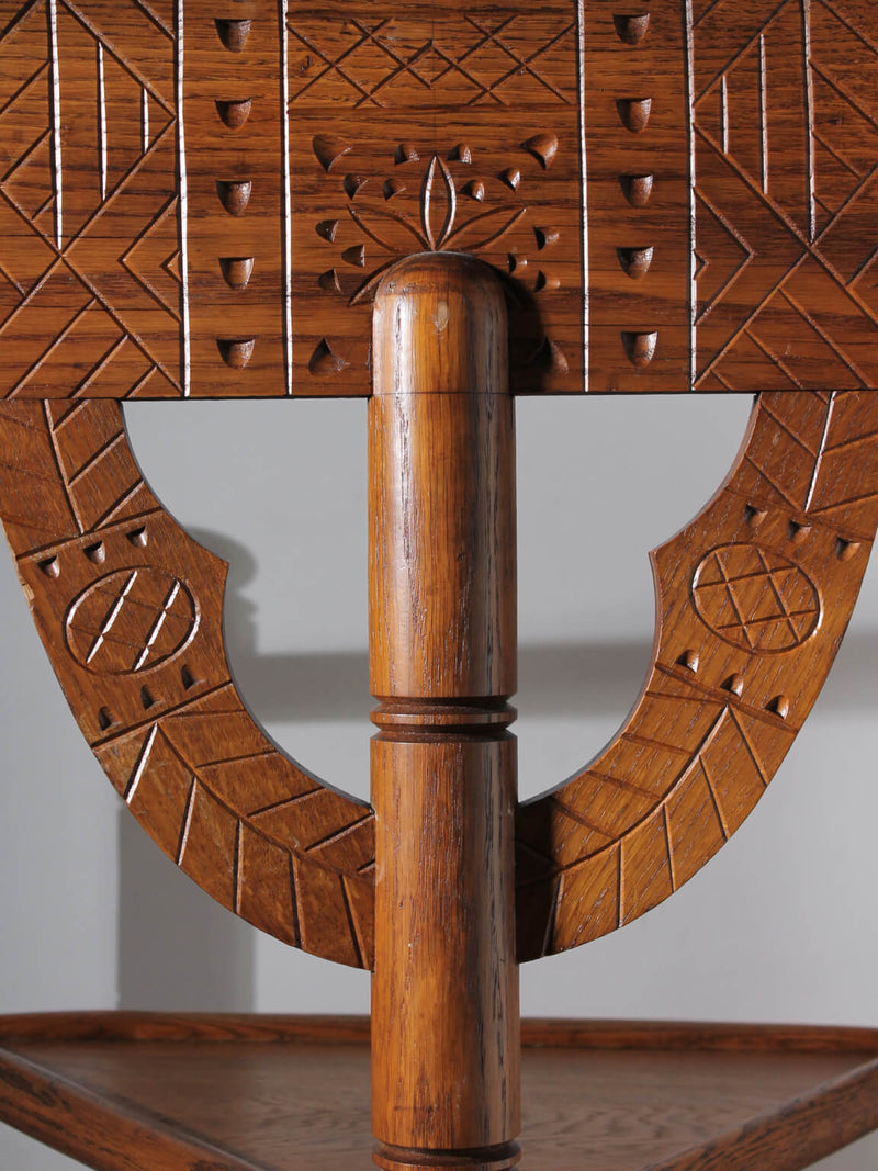 Swedish Carved Oak Monk Chair — close-up of intricately carved oak backrest