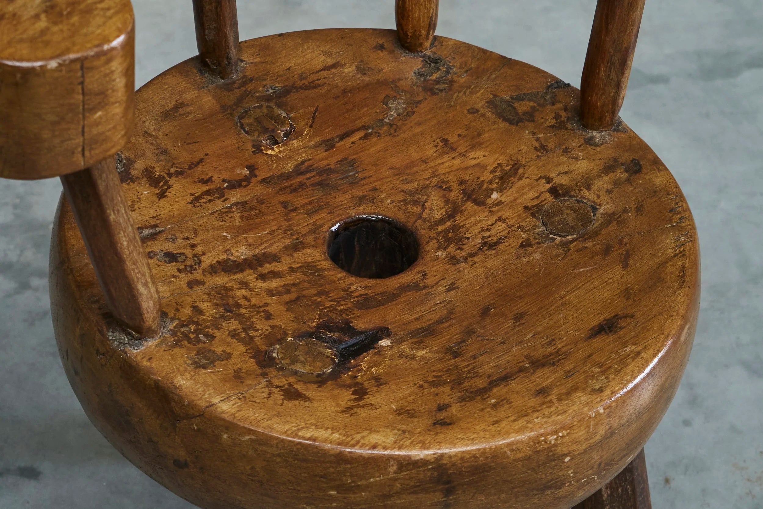 A Sculptural Three-Legged Provincial Vernacular Chair in Heavy Solid Oak France Early 20th Century — lifestyle setting
